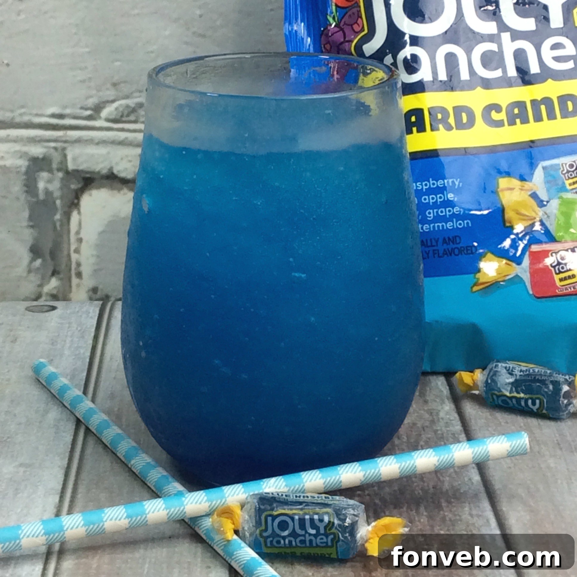 Preparing the Jolly Rancher infused vodka in a flask