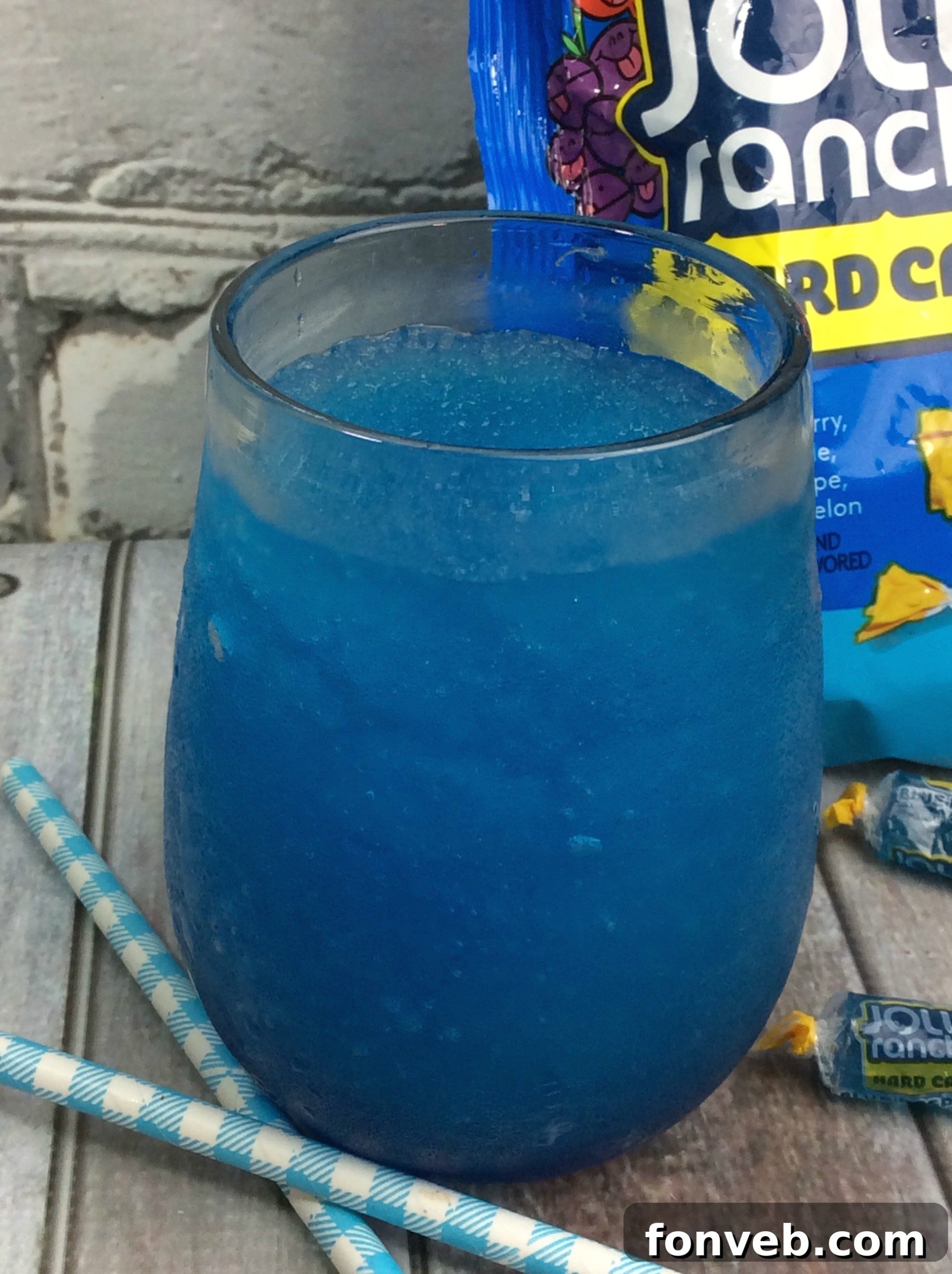Blue Raspberry Jolly Rancher infused vodka in a clear flask
