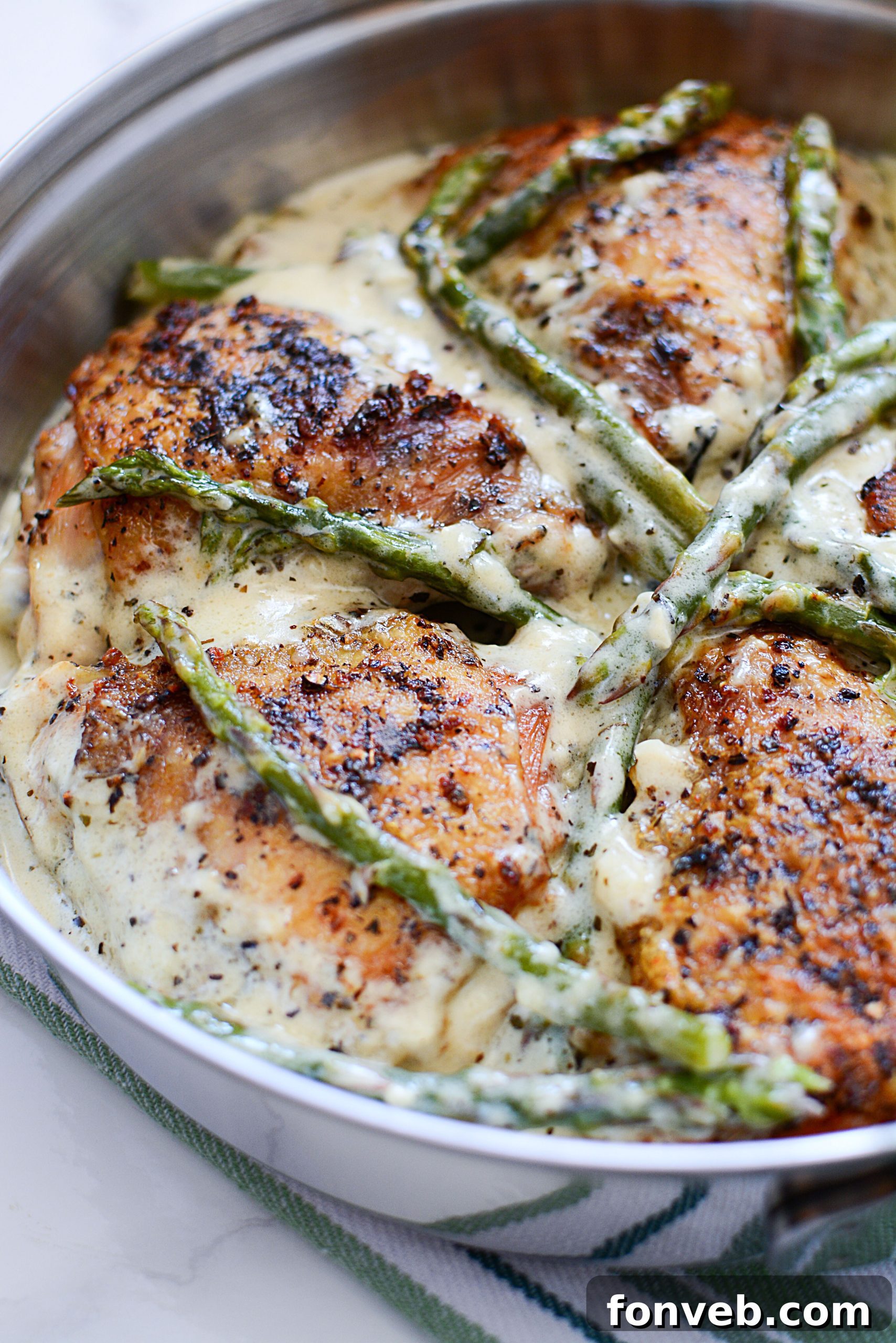 Another beautiful angle of the Creamy Garlic Dream Chicken and Asparagus, showing the rich texture of the sauce