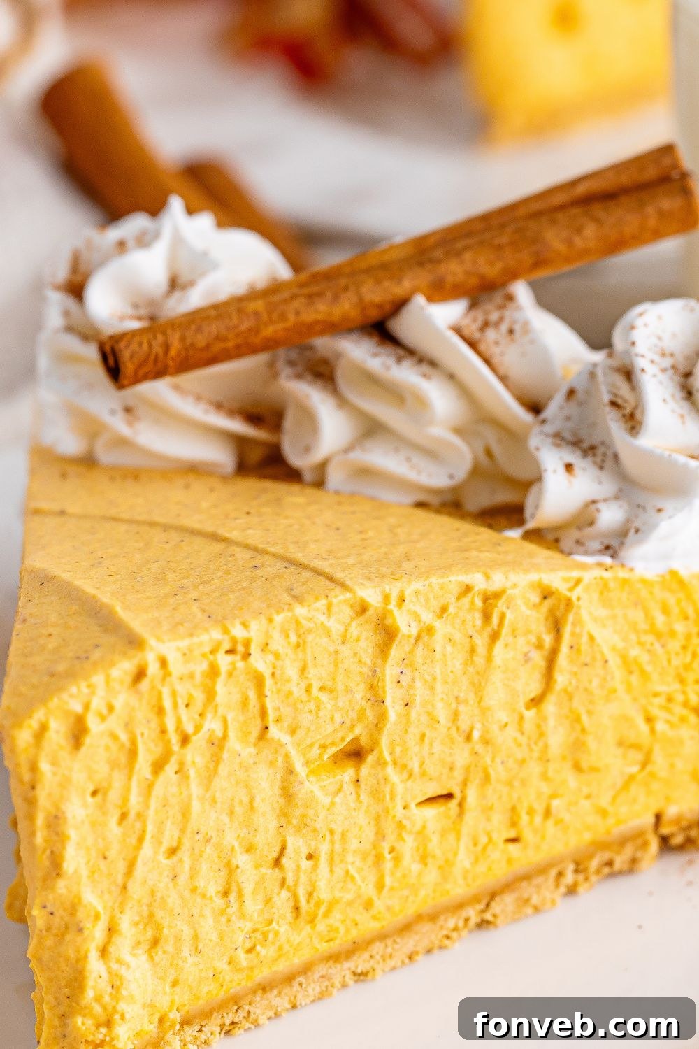 slice of pumpkin cheesecake on plate