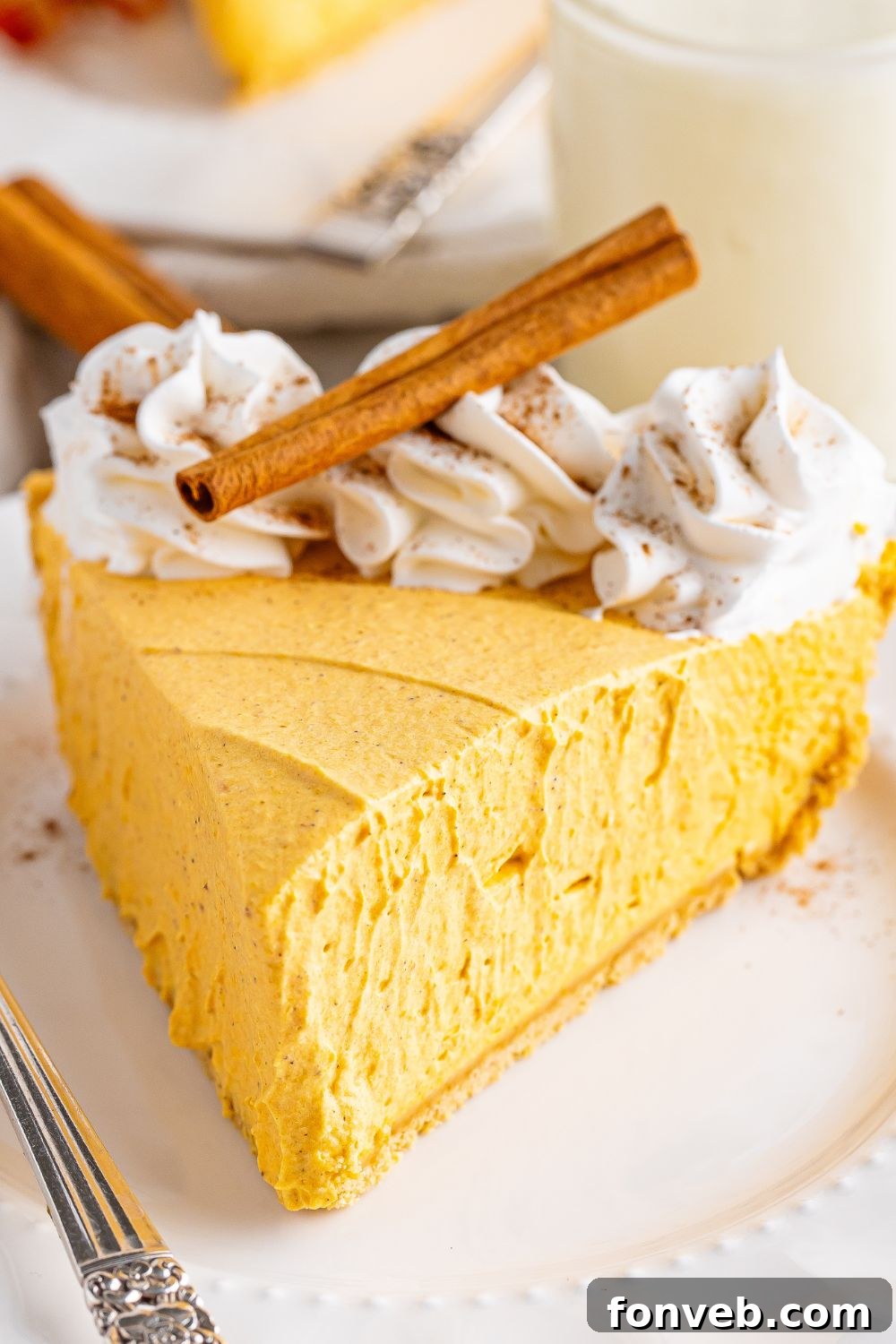 pumpkin spice cheesecake with slice taken out of pan