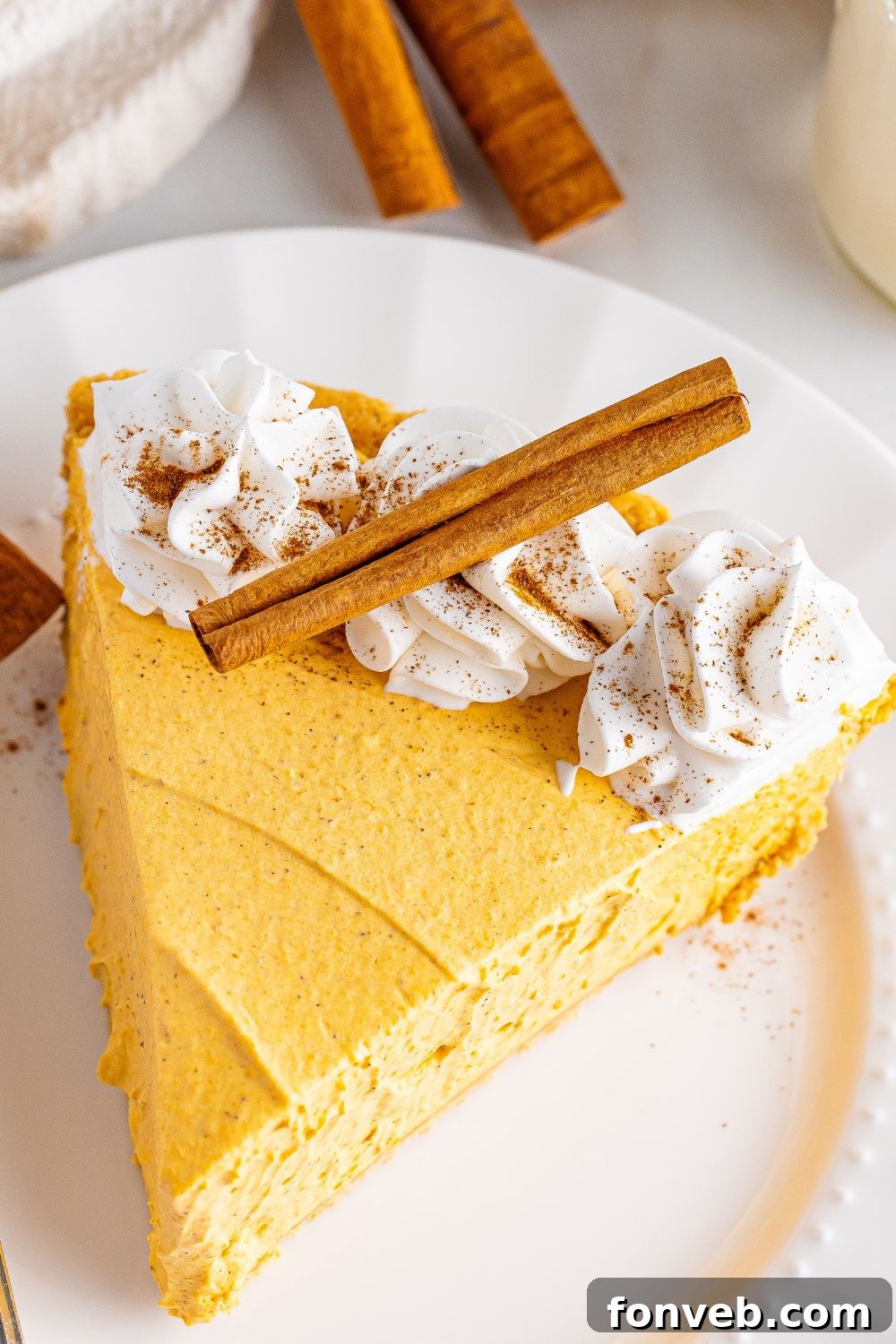 plate with a slice of cheesecake on it