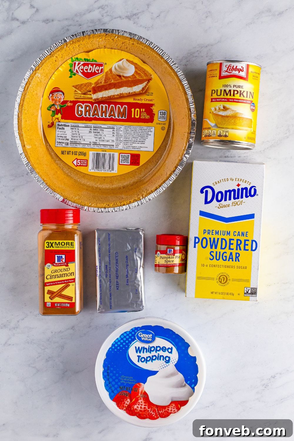 pumpkin spice cheesecake ingredients on table