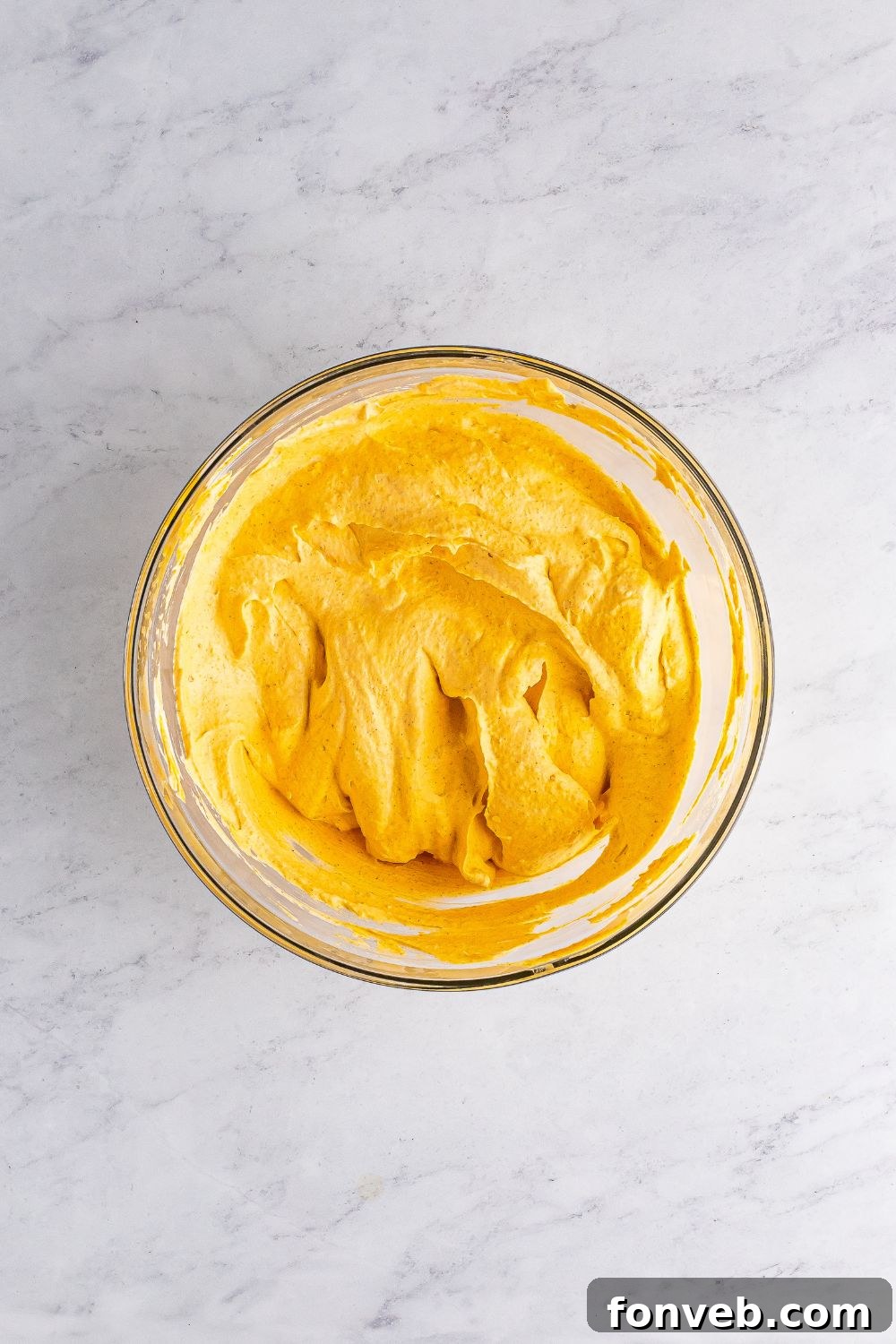 whipped cream folded in bowl 