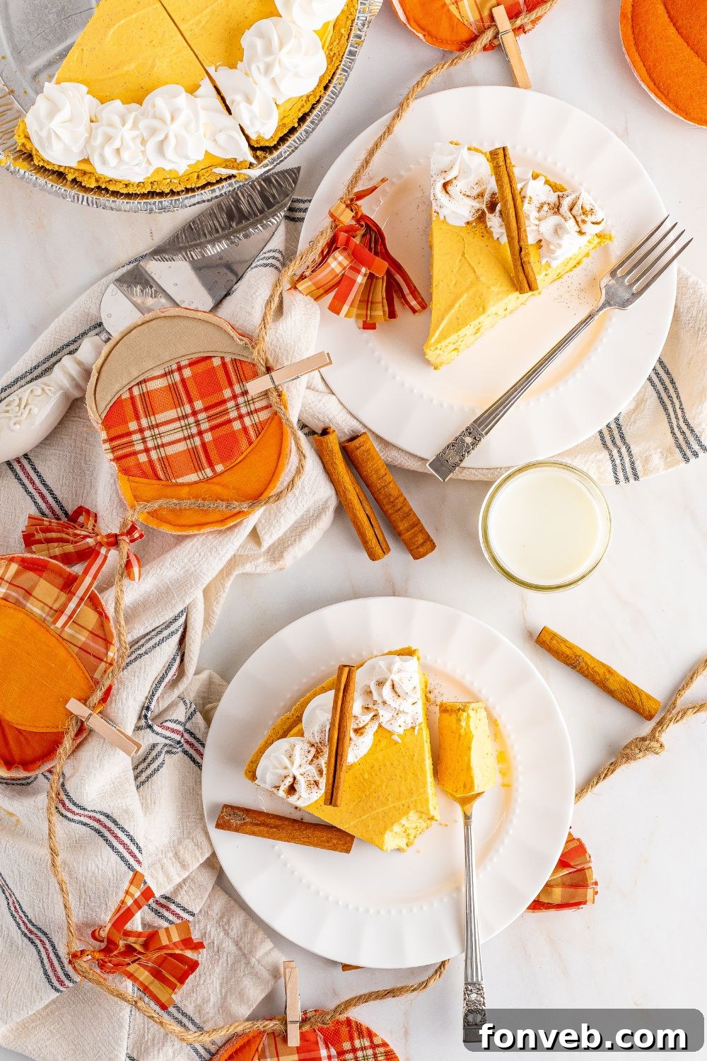 pumpkin cheesecake on plates on table 