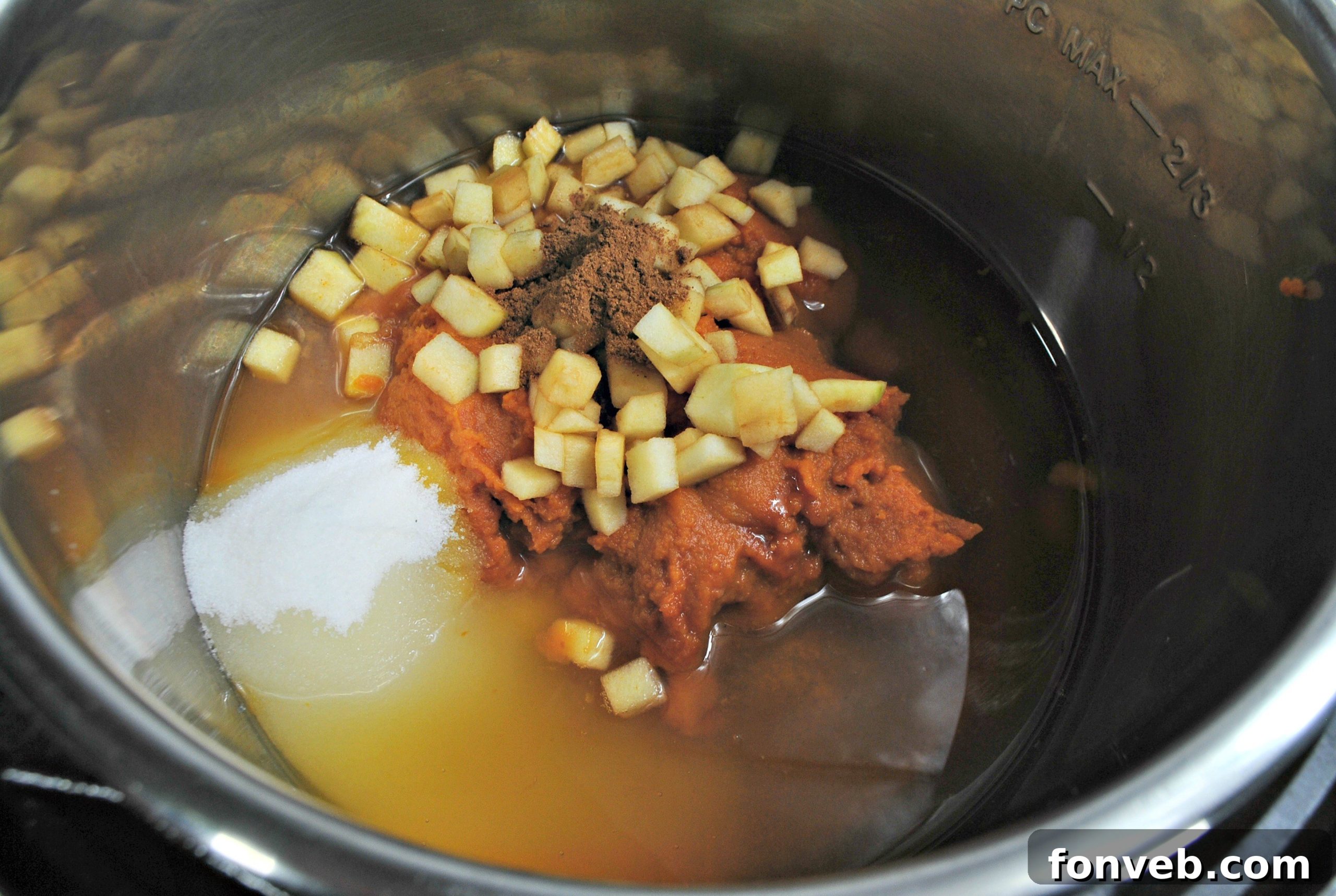 Spiced Instant Pot Pumpkin Butter 3 Jars of homemade pumpkin butter lined up on a rustic surface
