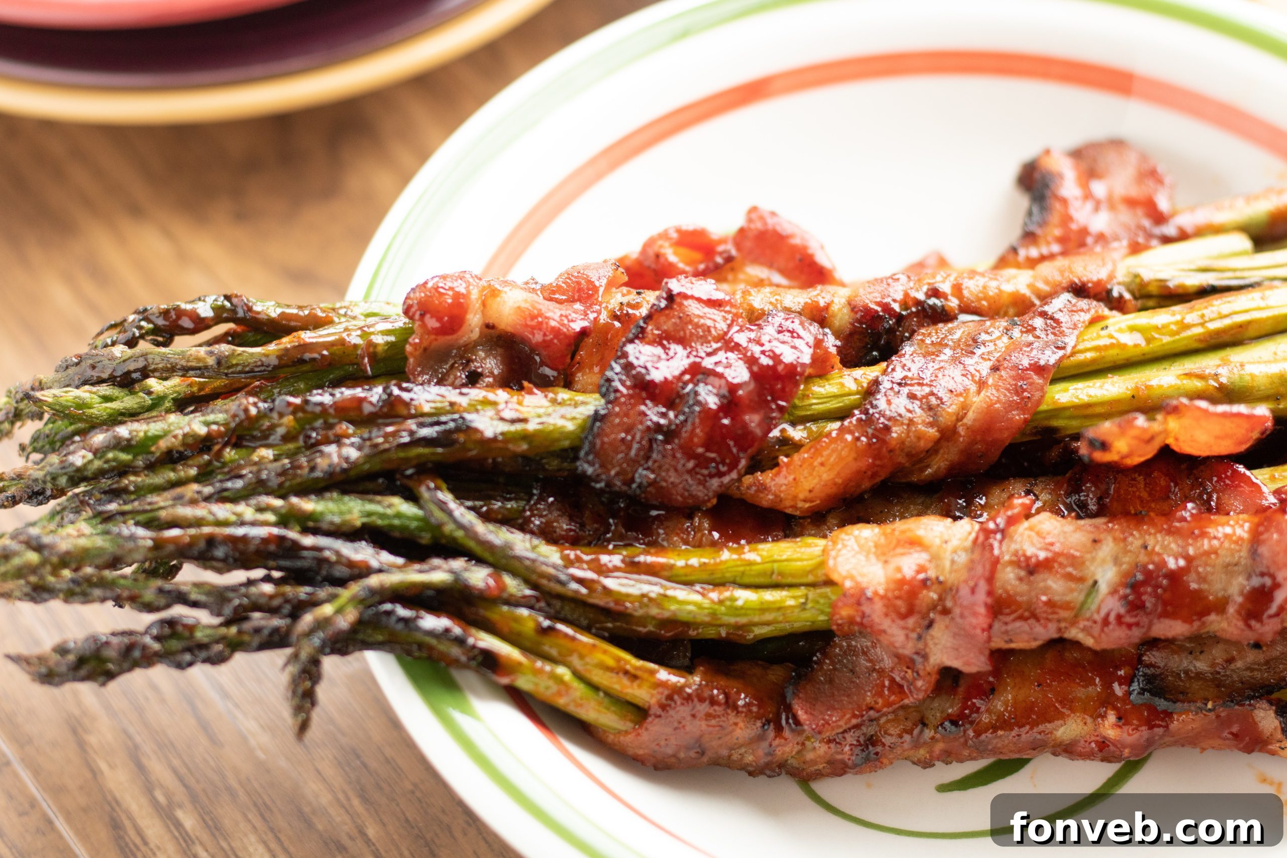 Beautifully prepared Brown Sugar Bacon Wrapped Asparagus bundles on a serving platter