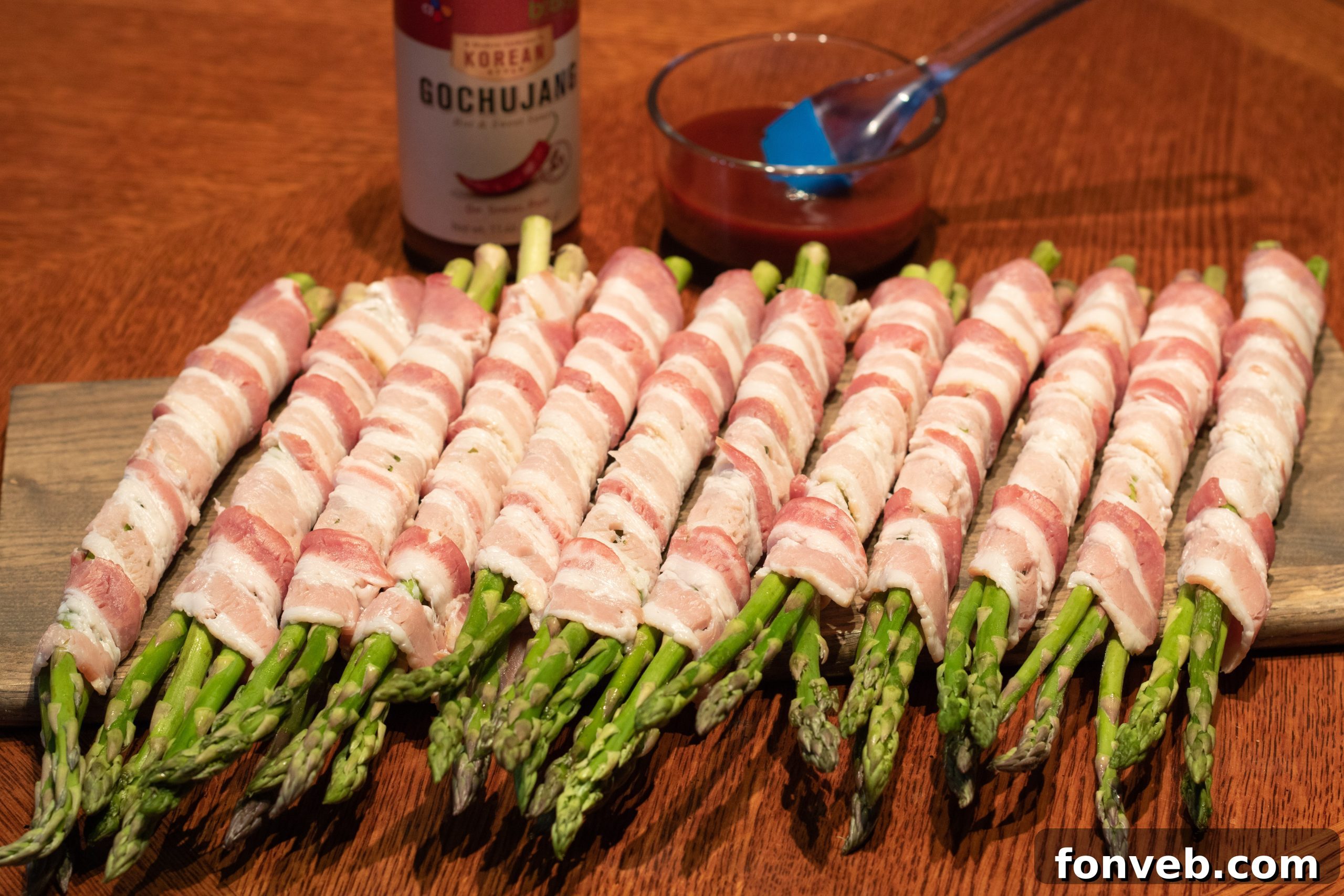 Fresh asparagus bundles wrapped in bacon, ready for the oven or grill