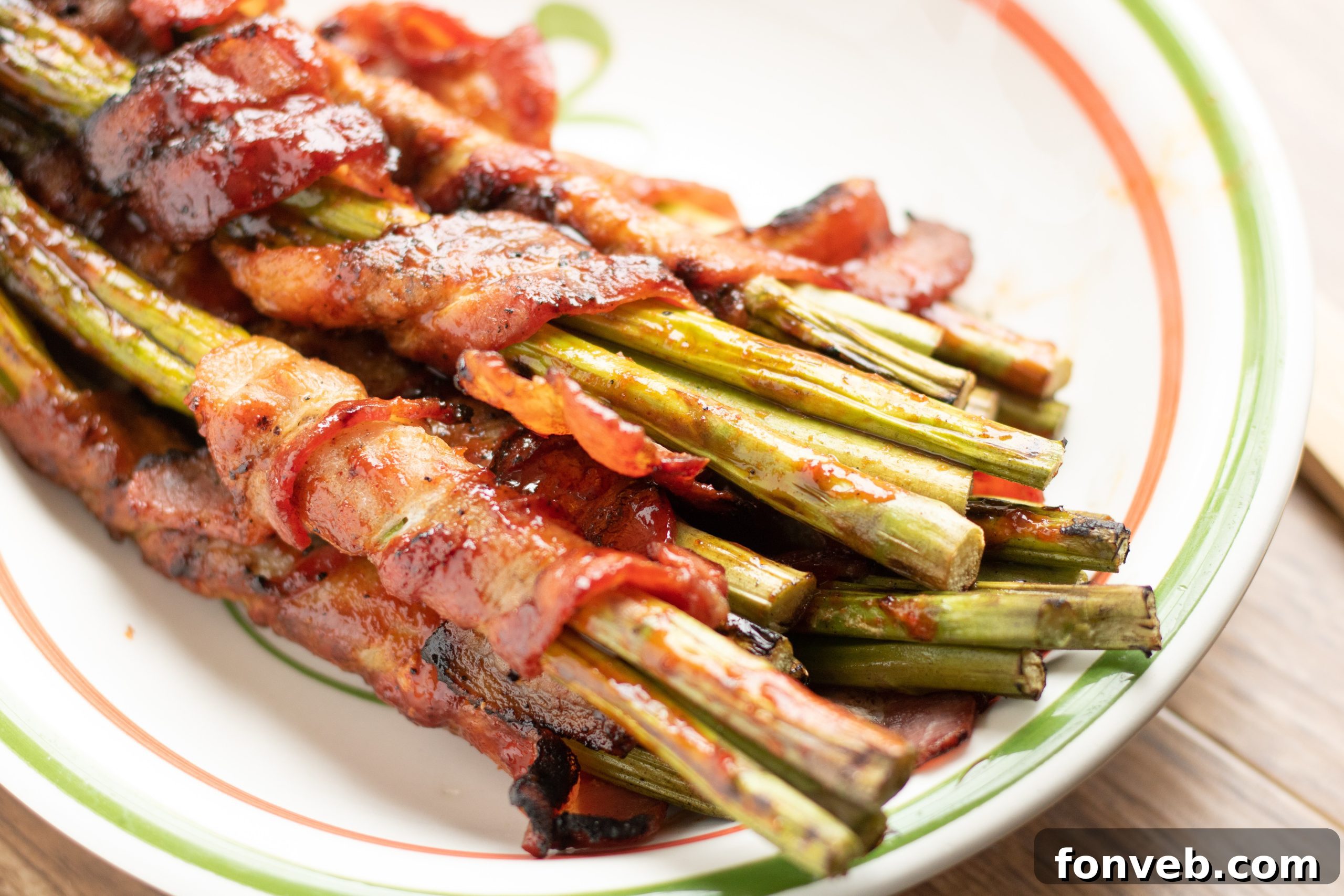 Platter of perfectly cooked bacon wrapped asparagus, ready for serving at a holiday meal