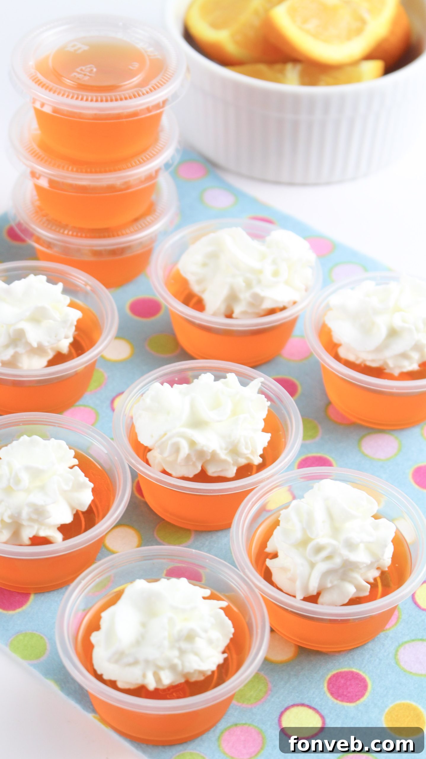 A selection of Orange Creamsicle Jello Shots on a plate, showcasing their inviting presentation.