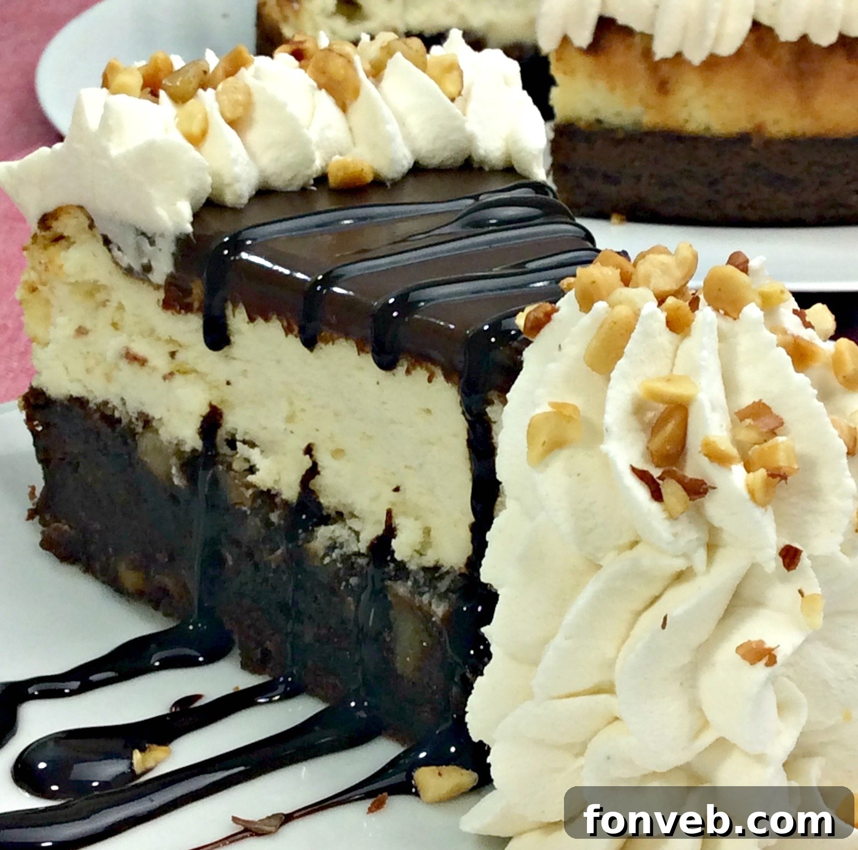 Sliced Hot Fudge Sundae Brownie Cheesecake showing layers