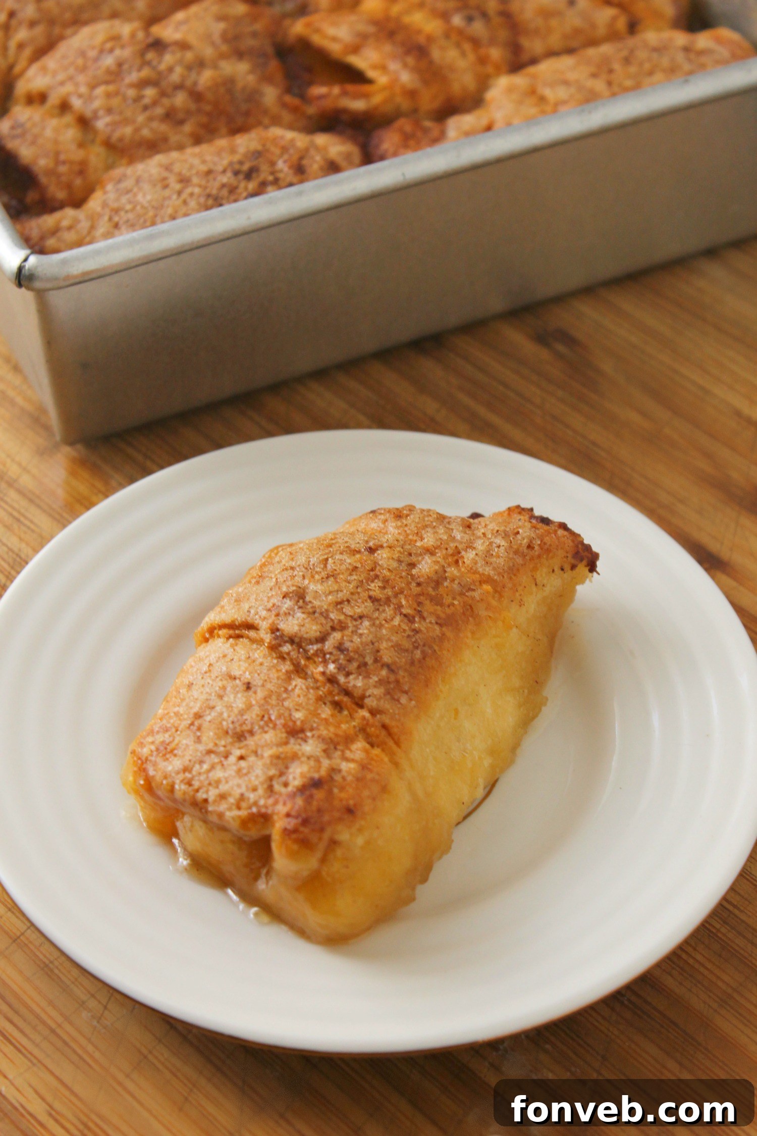 Peachy Keen Dumplings 8 Two peach dumplings served with vanilla ice cream and a drizzle of caramel sauce.