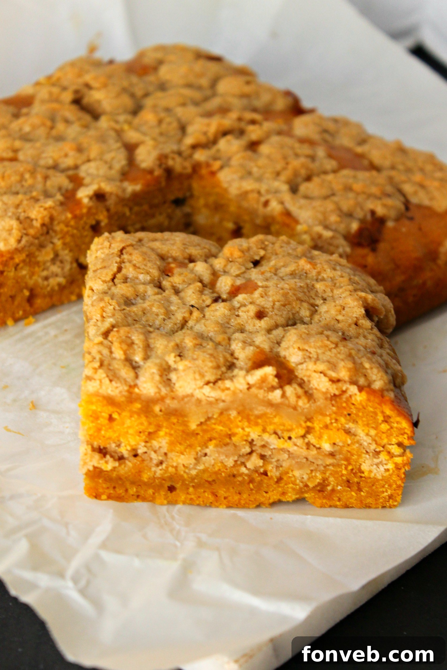 Pumpkin coffee cake after being drizzled with a sweet vanilla glaze, ready for serving