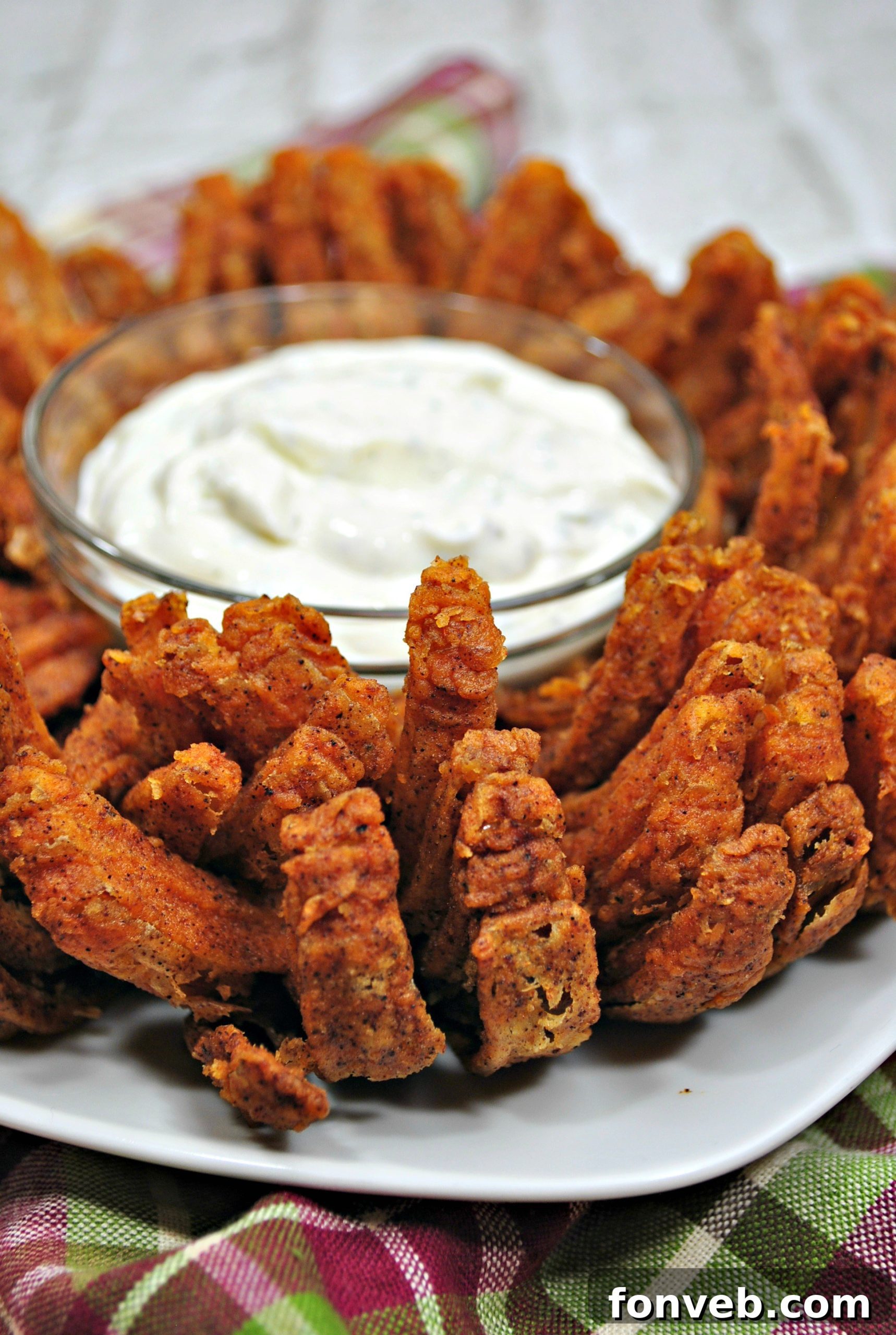 The finished homemade Bloomin' Onion, perfectly golden and crispy, ready to be enjoyed as a spectacular appetizer.