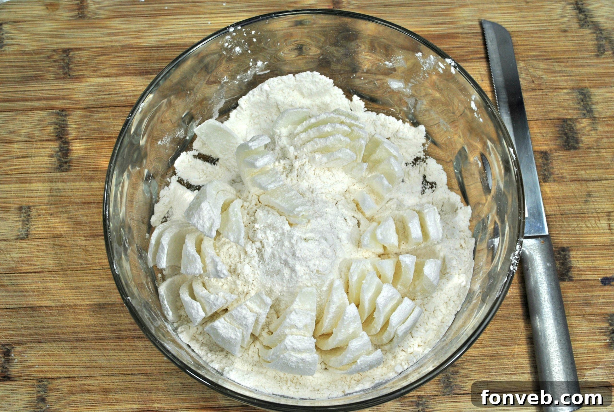A large bowl containing the dry ingredients for the Bloomin' Onion batter, including Panko breadcrumbs, flour, and various spices.