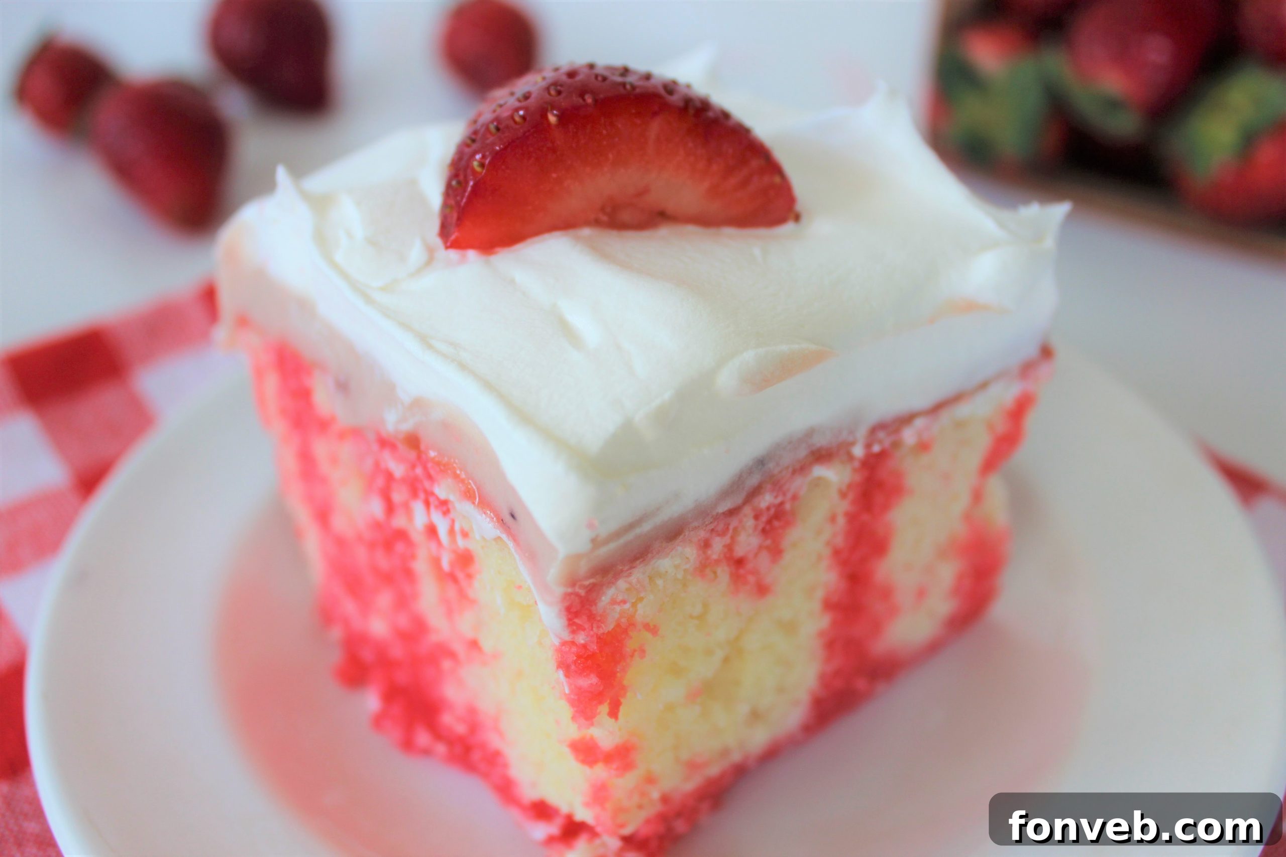 Luscious Strawberry Cheesecake Poke Cake 2 Slice of Strawberry Cheesecake Poke Cake with jello and pudding layers visible