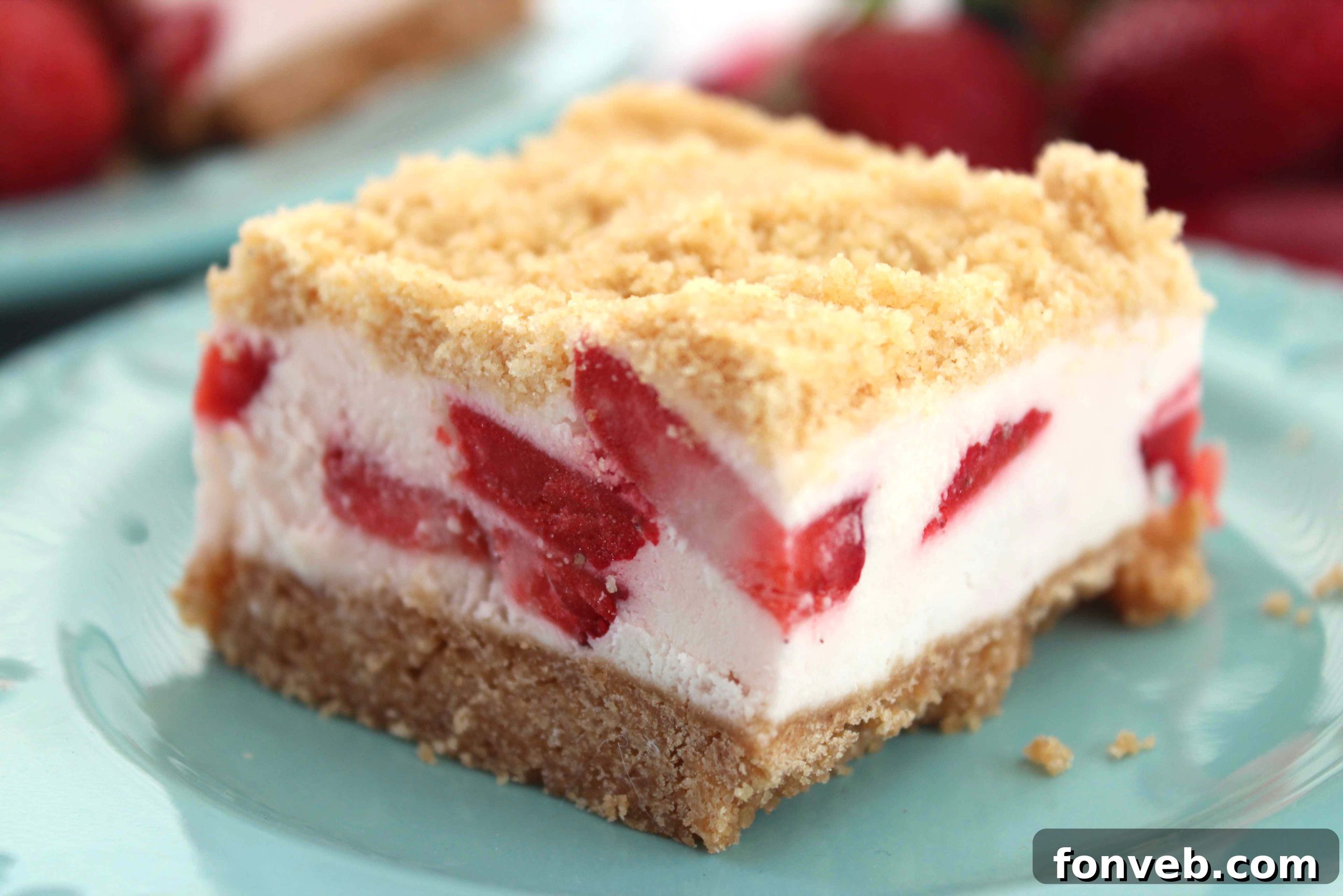 Strawberry Sugar Cookie Dream Bars 2 Close-up of freshly baked Strawberry Dream Sugar Cookie Bars with a creamy filling and crumb topping, ready to be enjoyed.