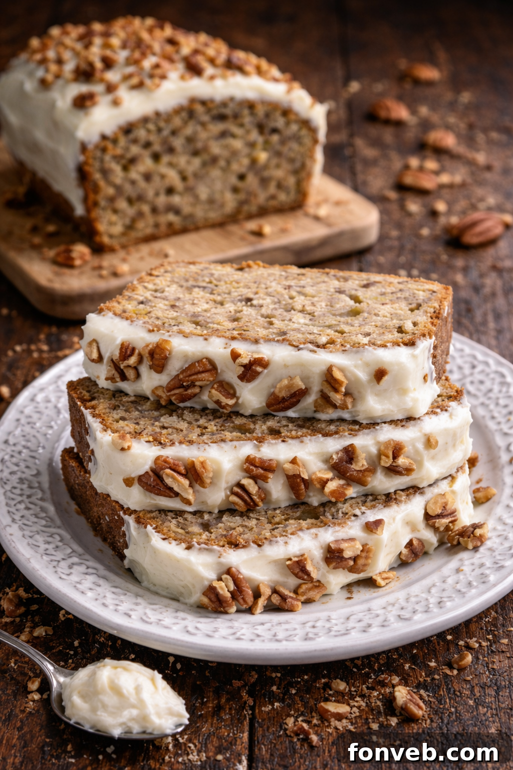 A warm, golden-brown loaf of Southern Hummingbird Bread cooling on a wire rack, ready for frosting.