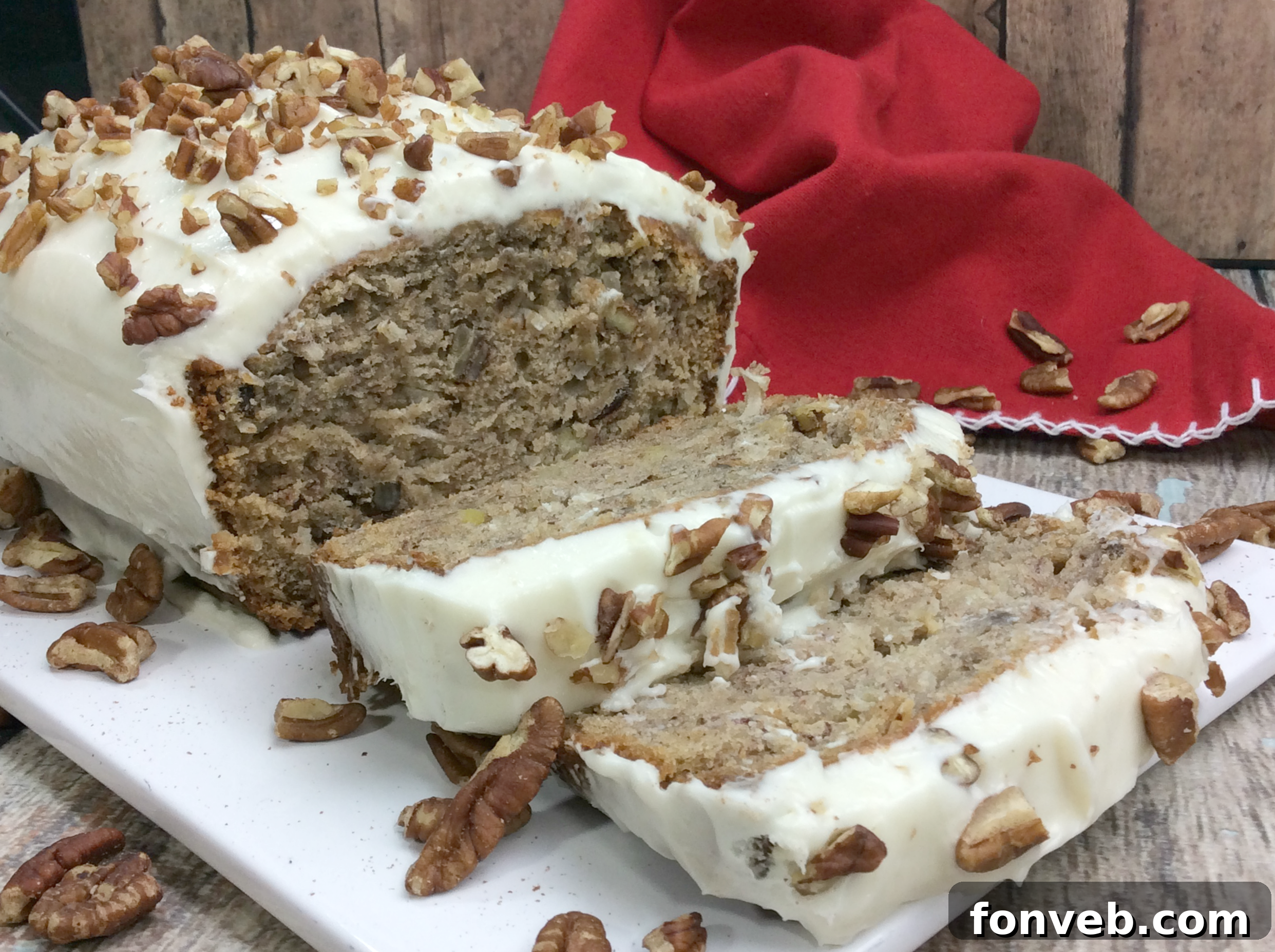 A final close-up of a generous slice of Southern Hummingbird Bread on a plate, perfectly frosted and ready to be enjoyed.
