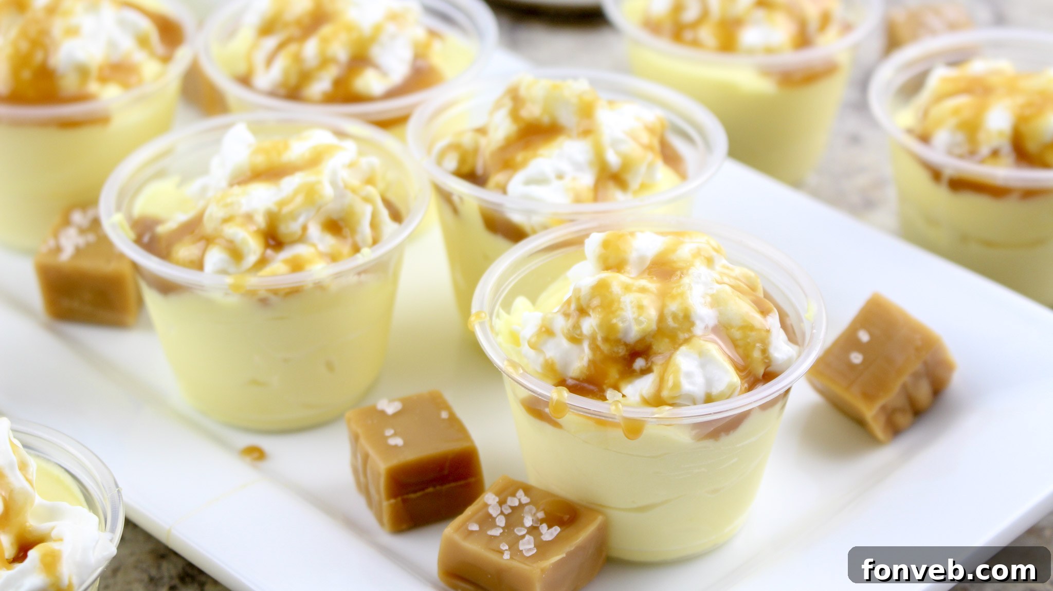 Salted Caramel Pudding Shots displayed with other party snacks