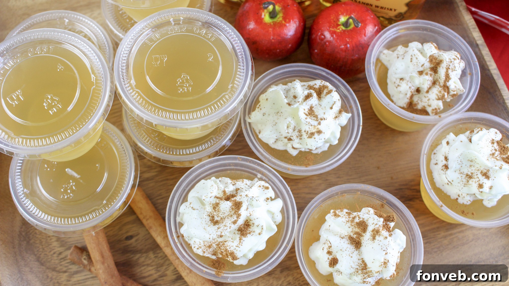 Multiple Apple Pie Jello Shots with a festive background