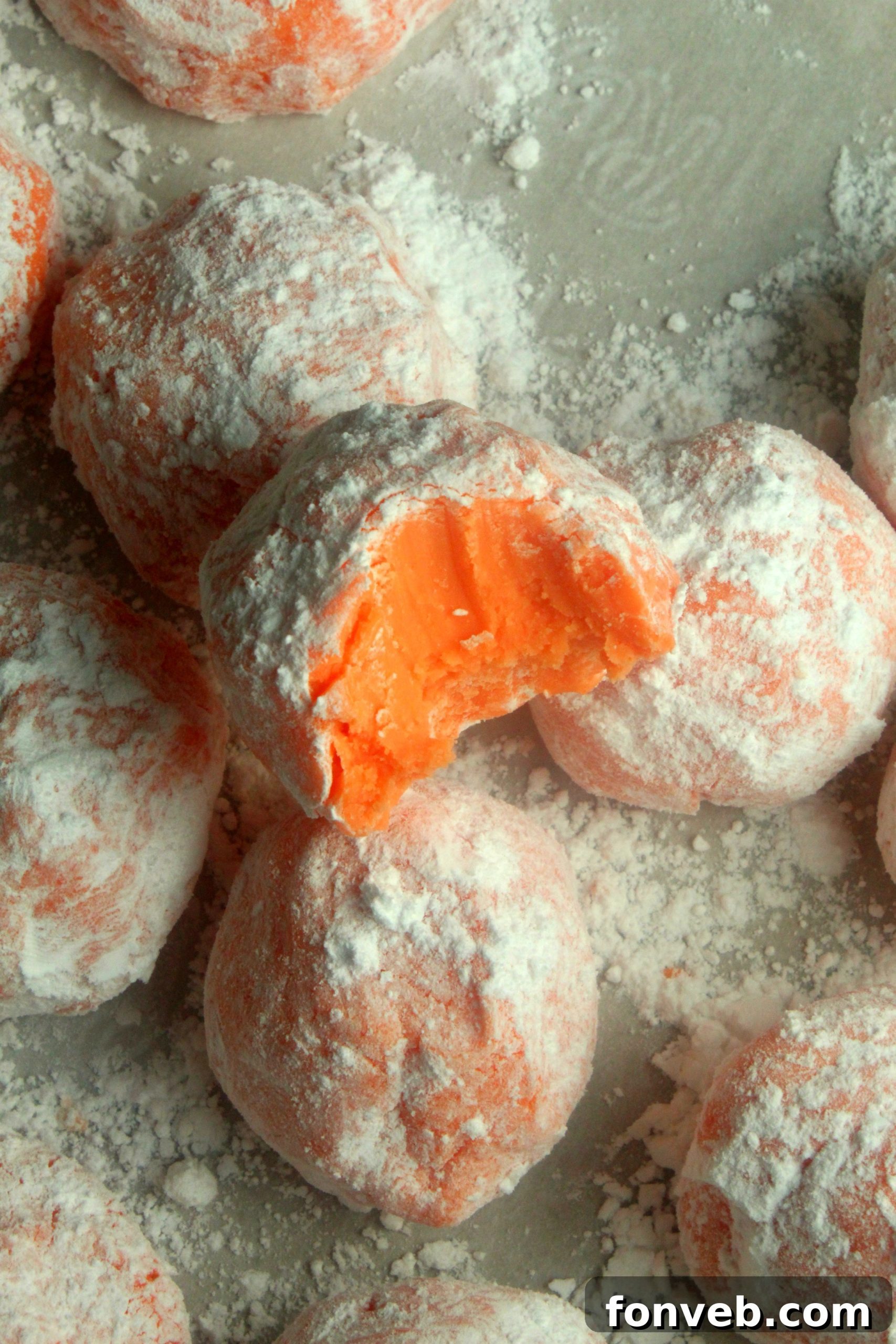 Sunny Orange Creamsicle No Bake Bites 4 Assortment of orange creamsicle truffles artfully arranged on a serving plate, highlighting their vibrant color and inviting texture.