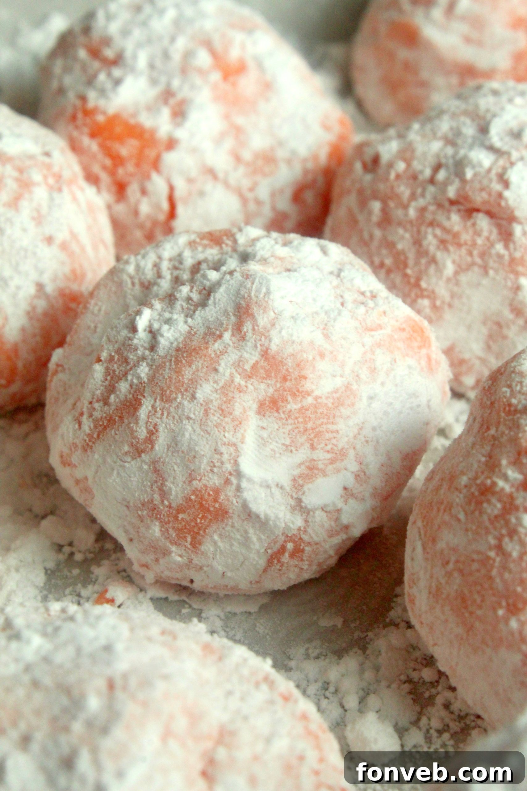 Sunny Orange Creamsicle No Bake Bites 7 Stack of orange creamsicle truffles in a small decorative bowl, showcasing their inviting texture.