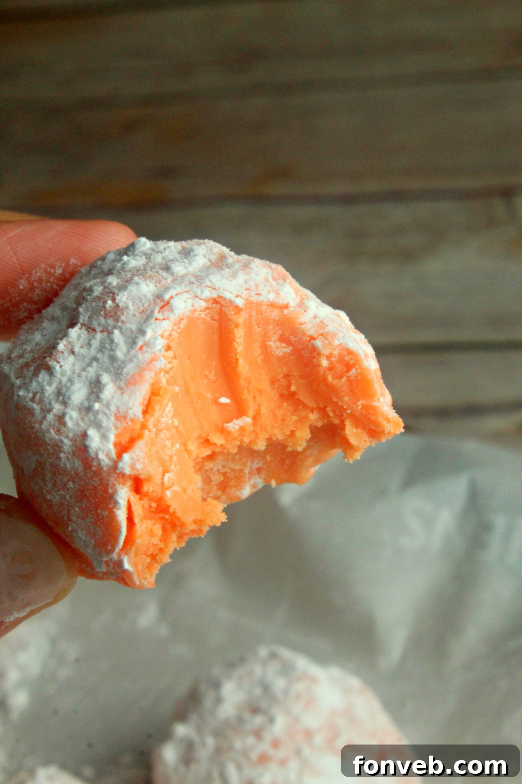 Sunny Orange Creamsicle No Bake Bites 9 Overhead shot of orange creamsicle truffles on parchment paper, ready for chilling.