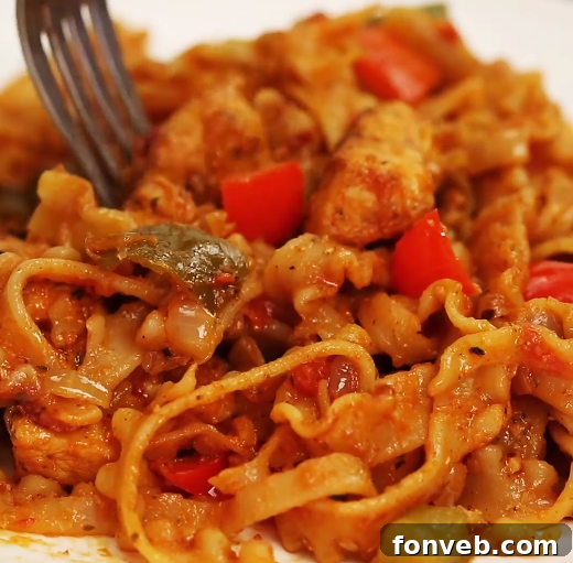 A serving of the delicious chicken fajita pasta, showing steam and freshness