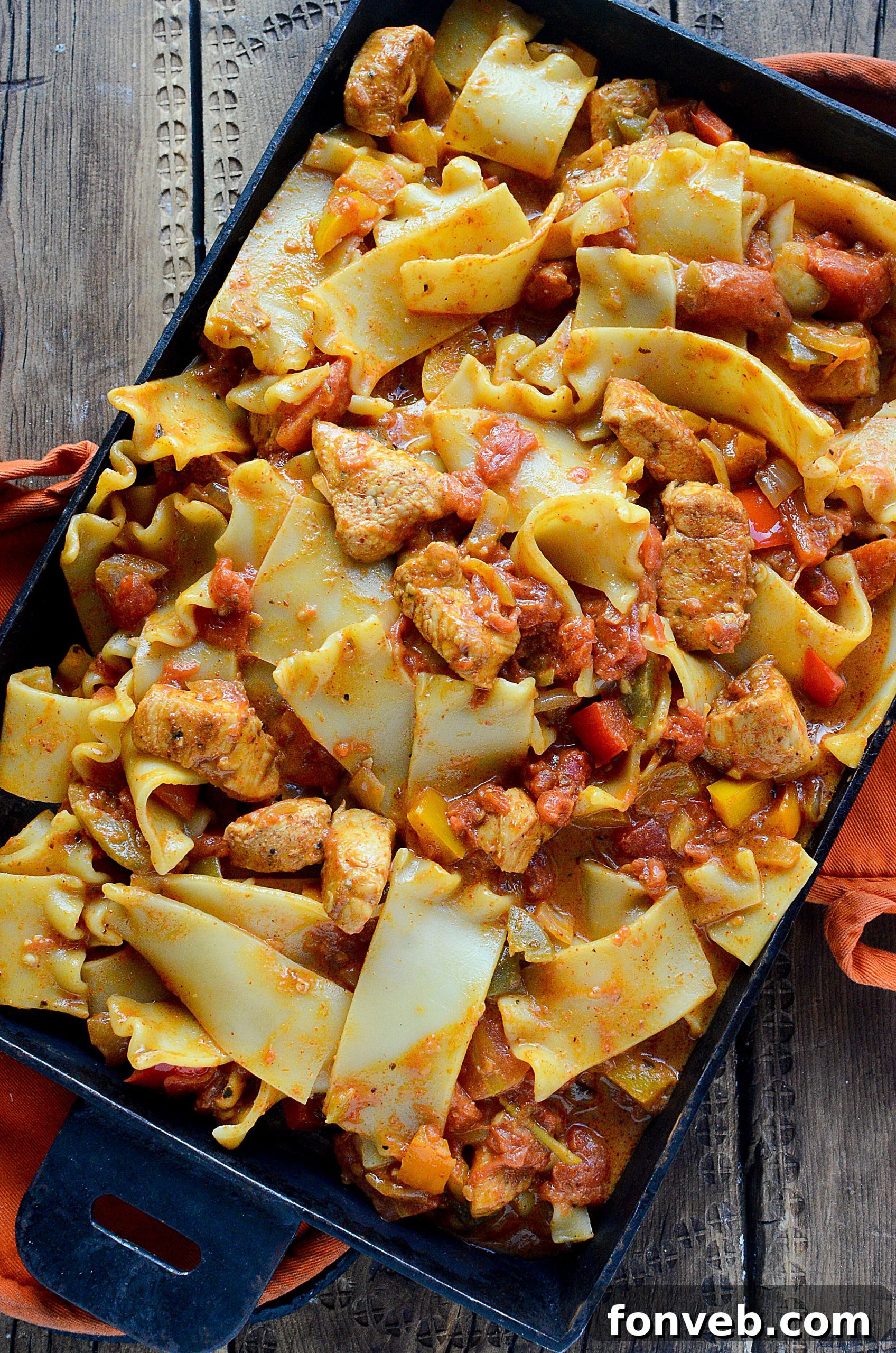 Close-up of creamy chicken fajita pasta in a skillet, ready for serving