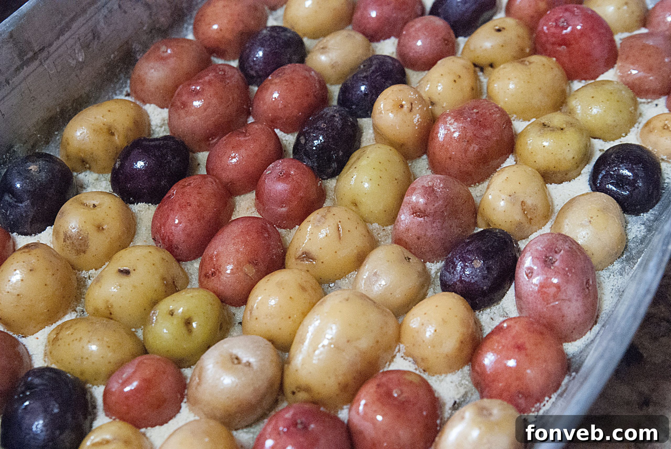 Close-up shot of Crispy Garlic Parmesan Potatoes showing the crispy cheese crust.