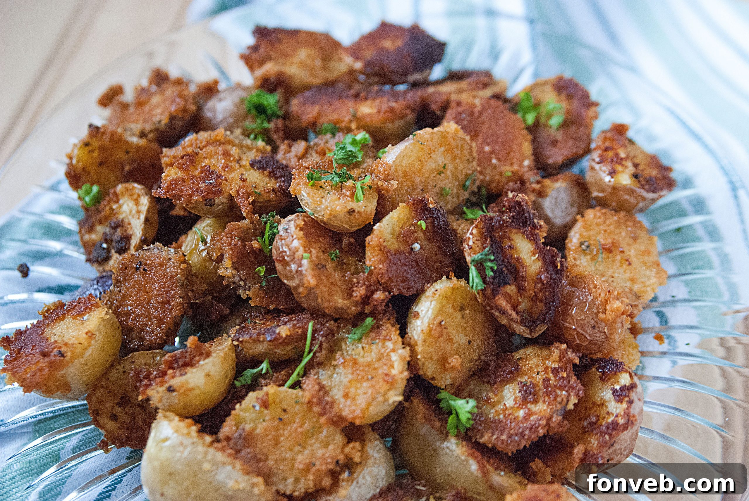 Variety of spices and fresh potatoes ready for roasting.