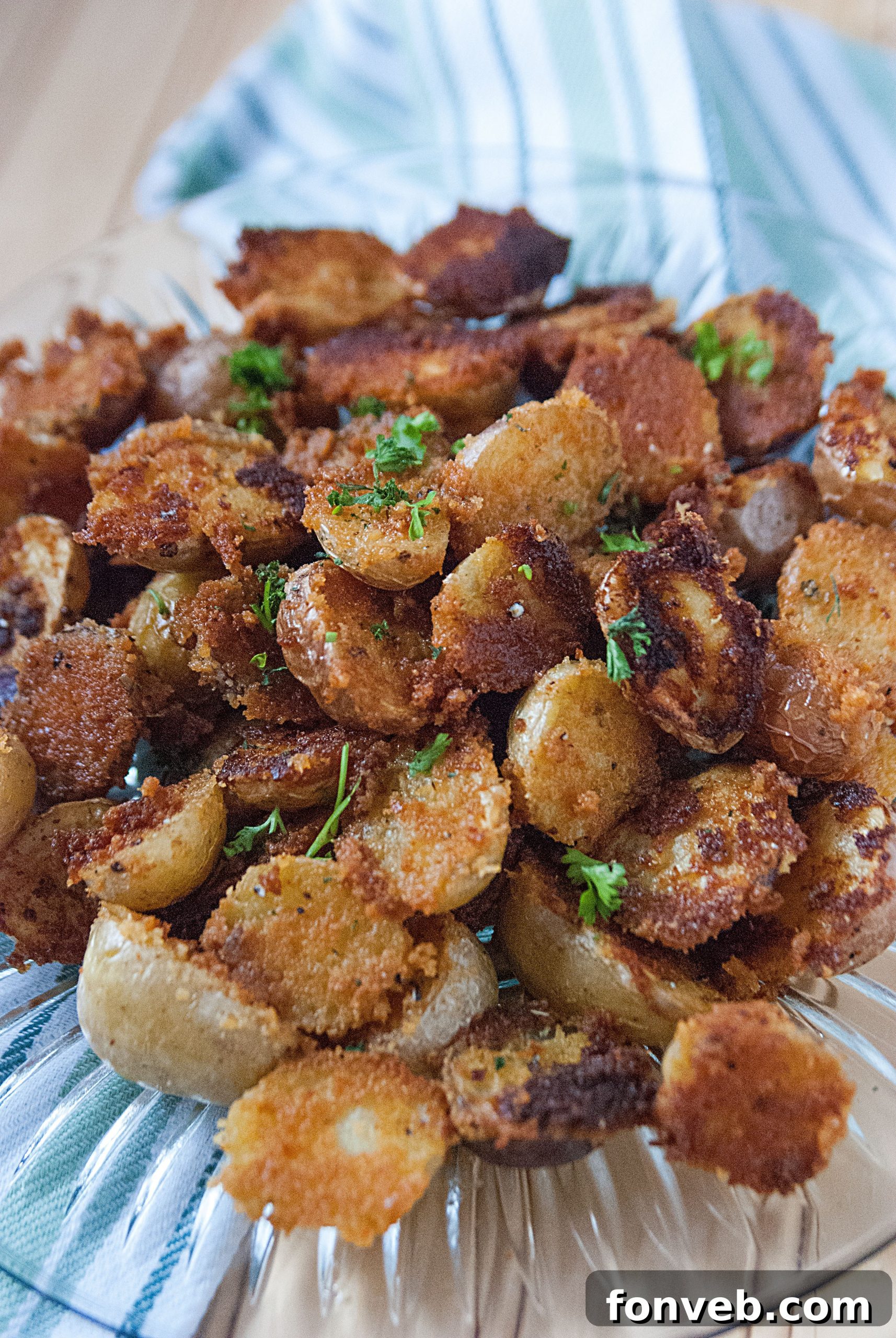 Oven-roasted Crispy Garlic Parmesan Potatoes in a baking dish, fresh from the oven.