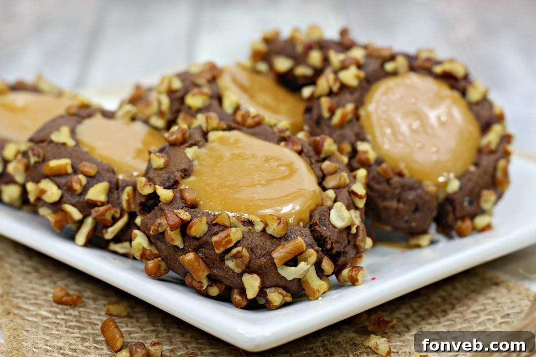 Chewy Turtle Thumbprint Delights 8 A plate of freshly baked Turtle Thumbprint Cookies, perfect for sharing.