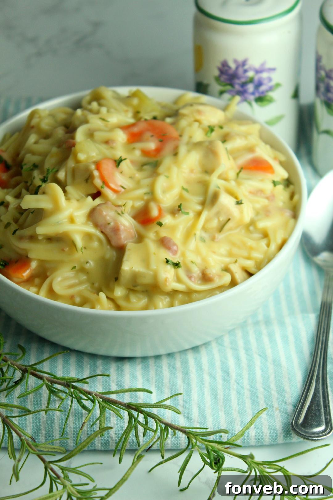 Irresistibly Creamy Chicken Noodle Soup 9 Crack Chicken Noodle Soup in a white bowl, ready to be served