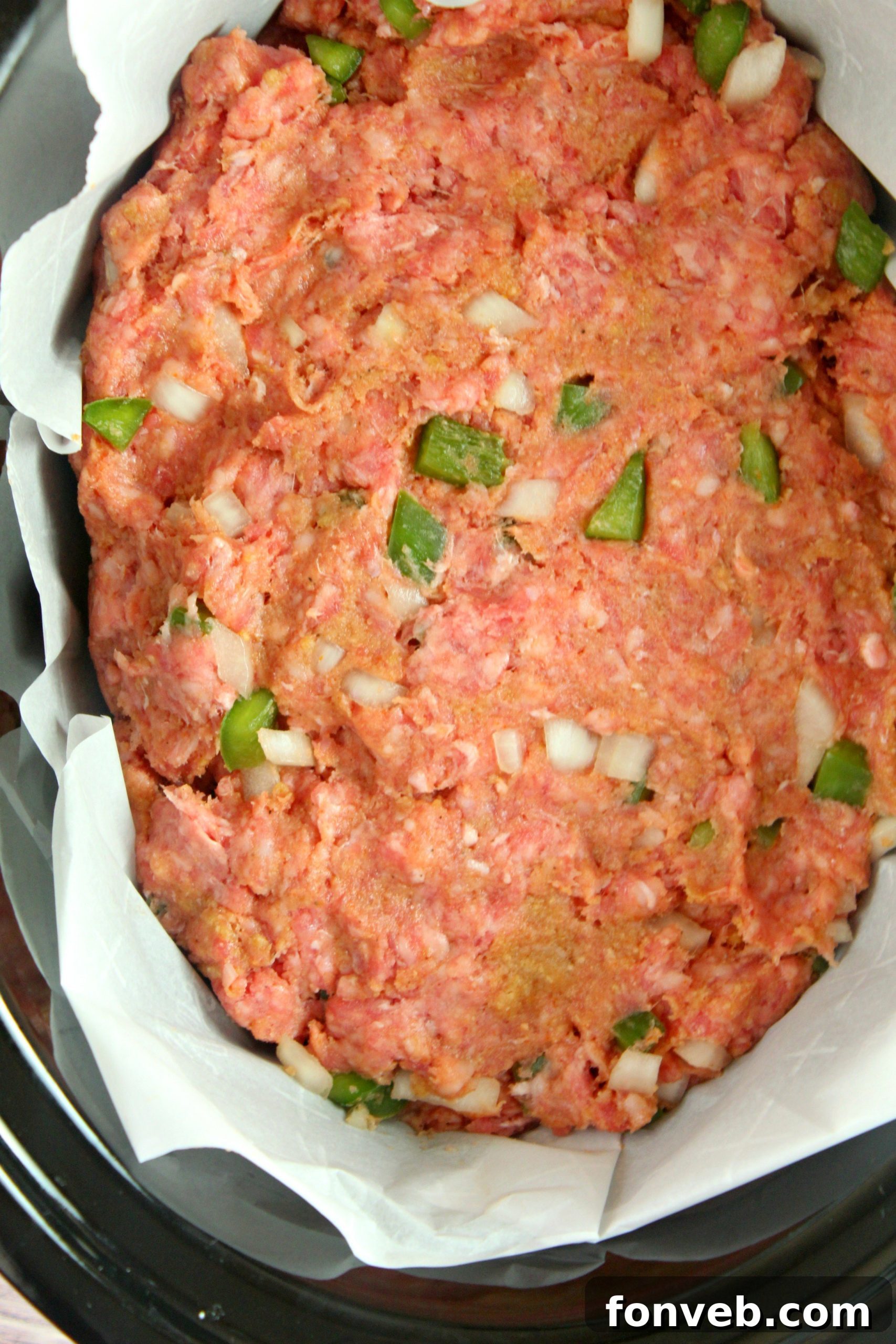 Close-up of slow cooker meatloaf, showing its moist texture and rich color.