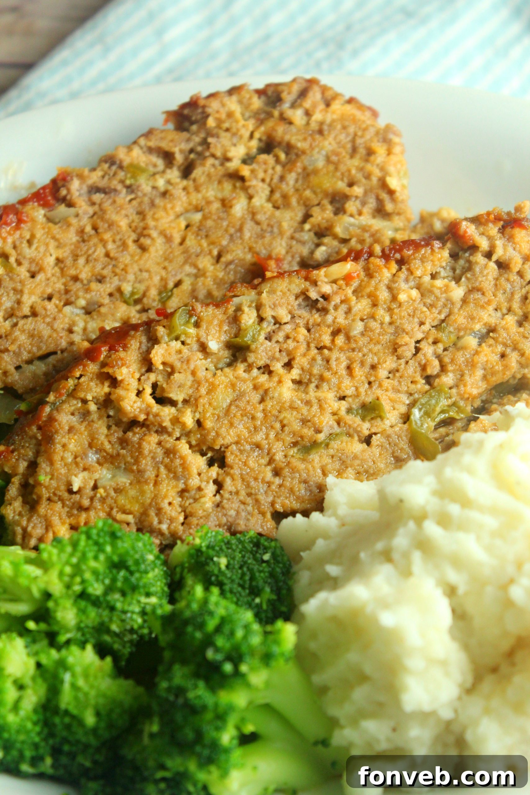 Close-up of the crispy edges and glazed top of the slow cooker meatloaf.