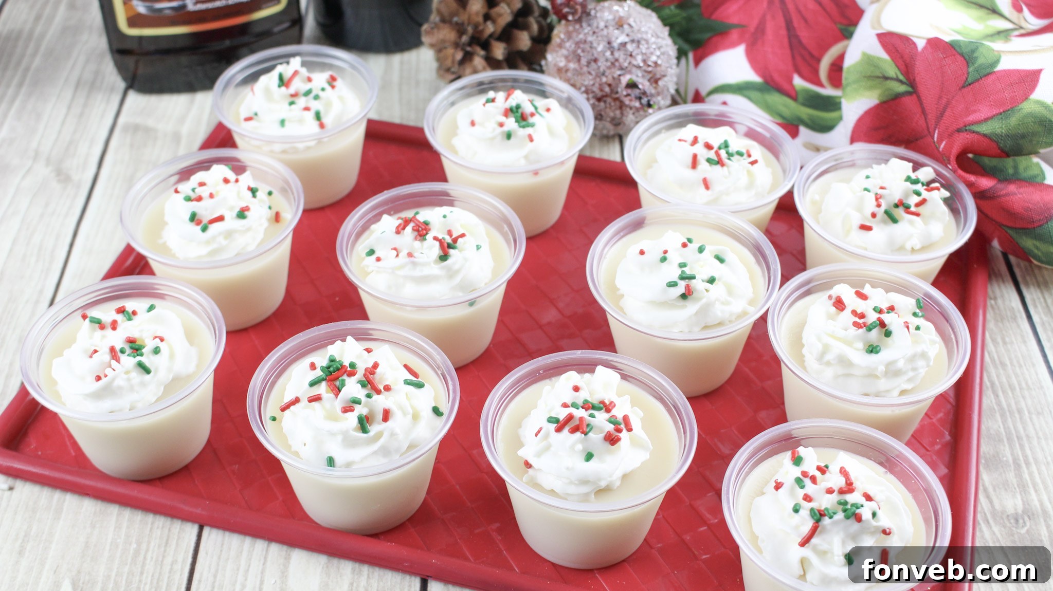 Close-up of a single Christmas Sugar Cookie Jello Shot, adorned with sprinkles, showcasing its festive appeal.