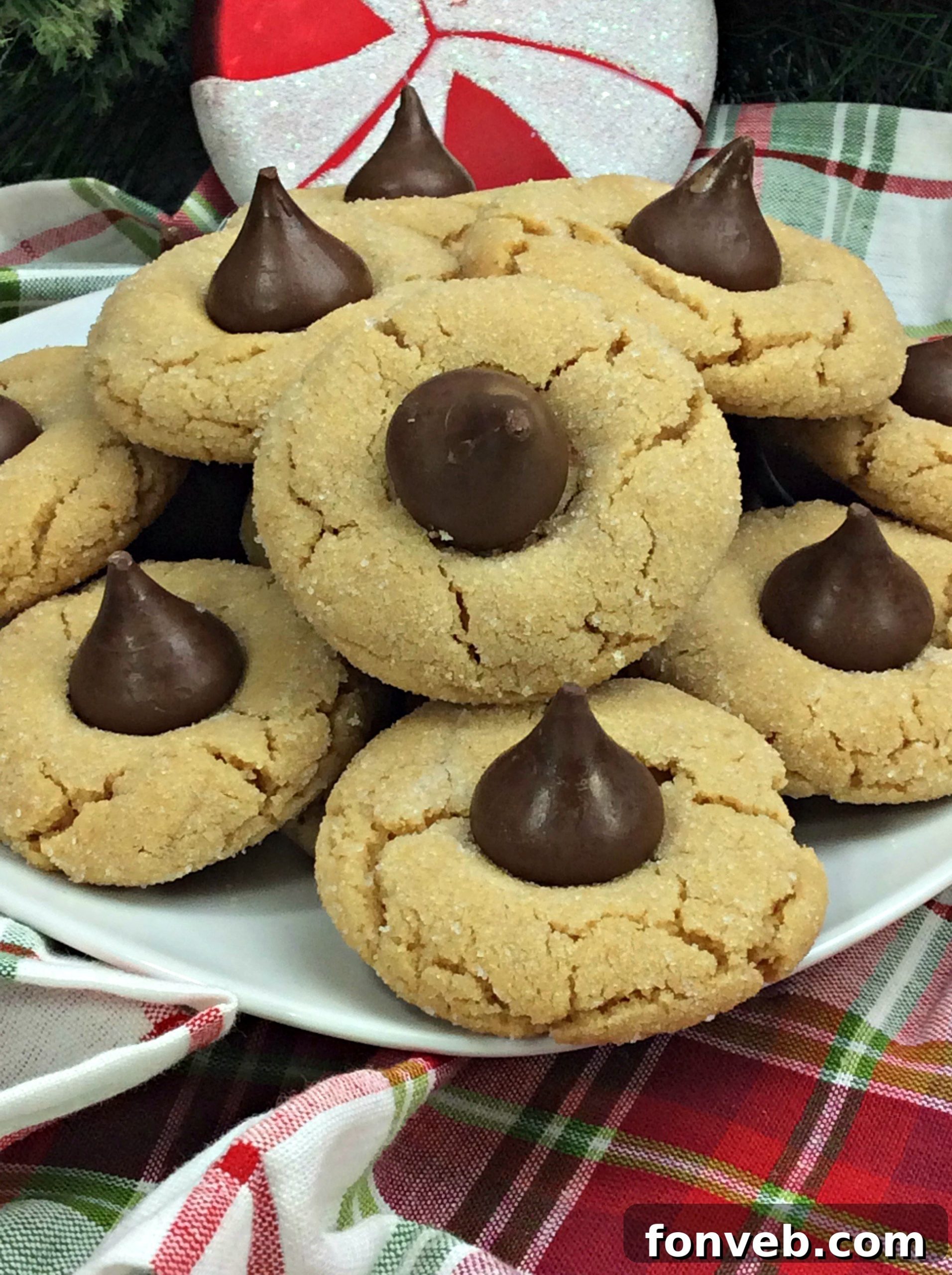 A plate of Peanut Butter Blossom Cookies ready to be served, highlighting their festive appeal for any occasion.