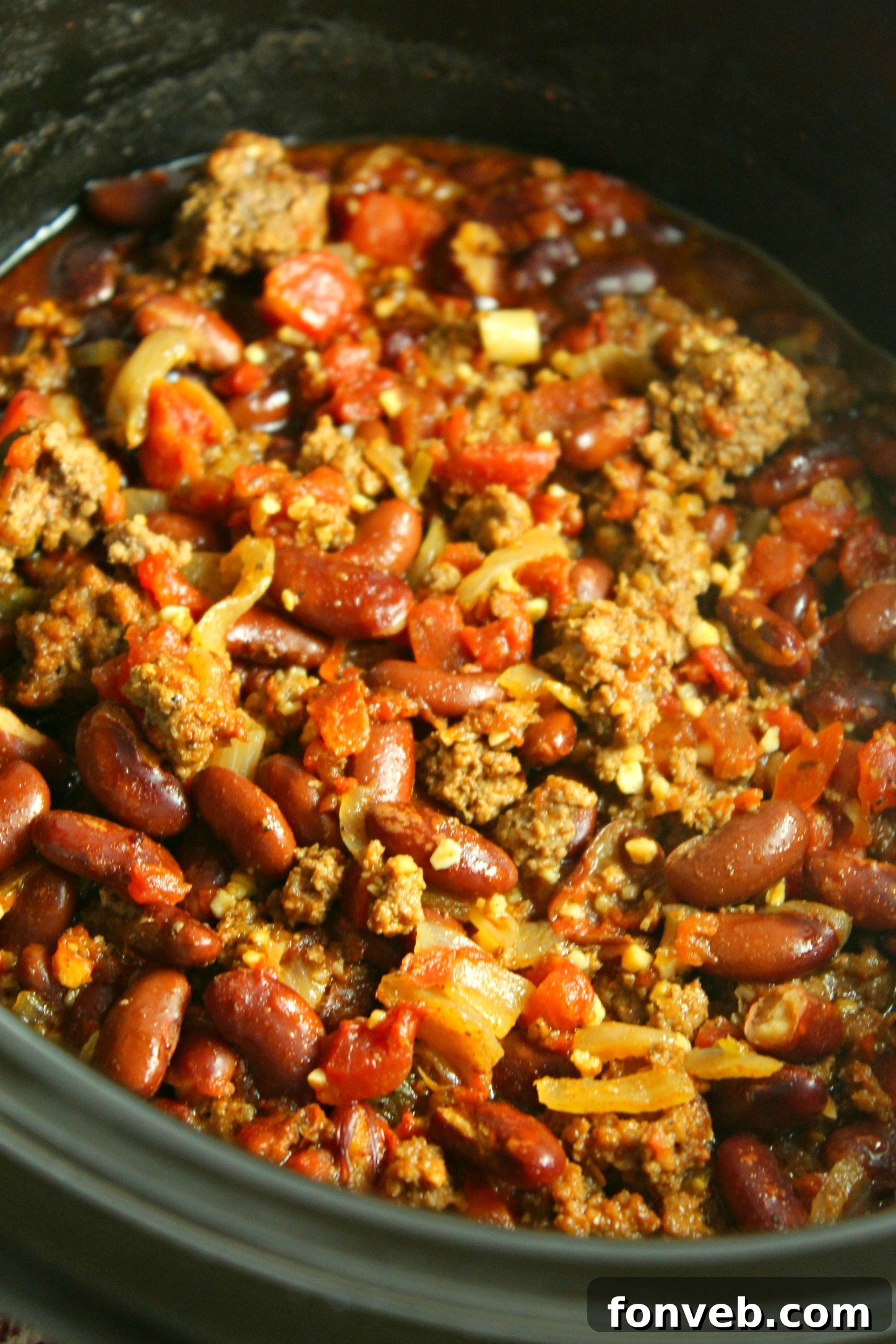 Ultimate Homestyle Slow Cooker Chili 3 Delicious homemade chili simmering, showcasing its deep color and texture.