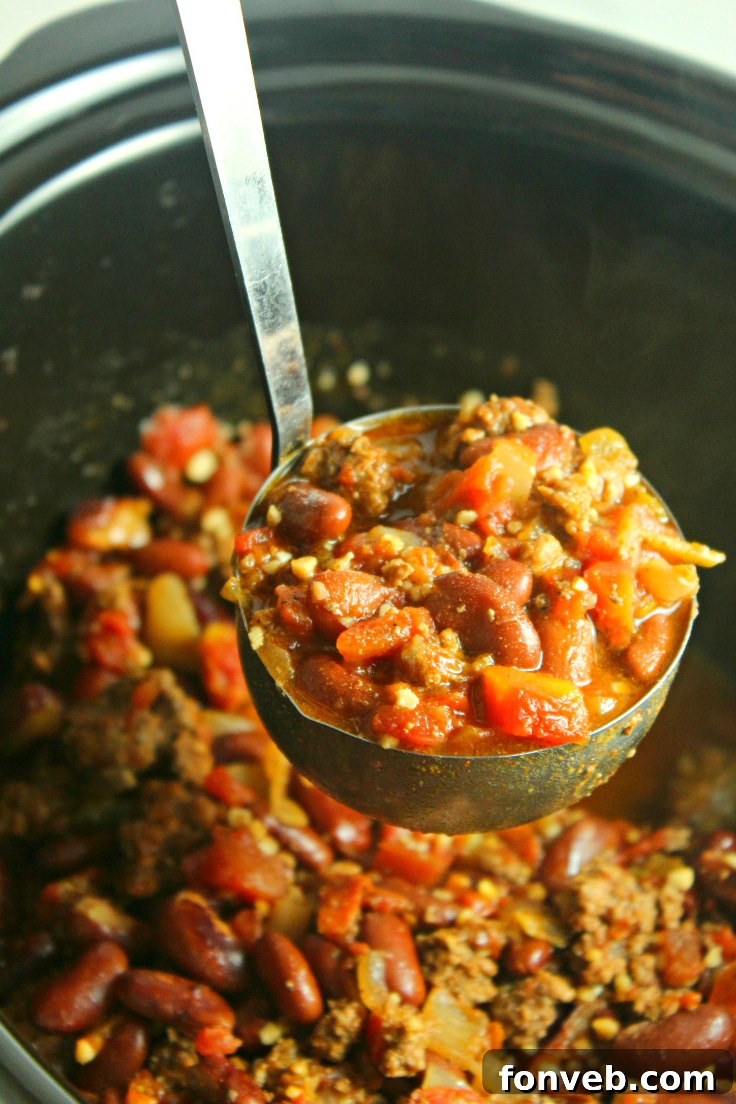 Ultimate Homestyle Slow Cooker Chili 9 Flavorful slow cooker chili served over fluffy white rice for a complete meal.