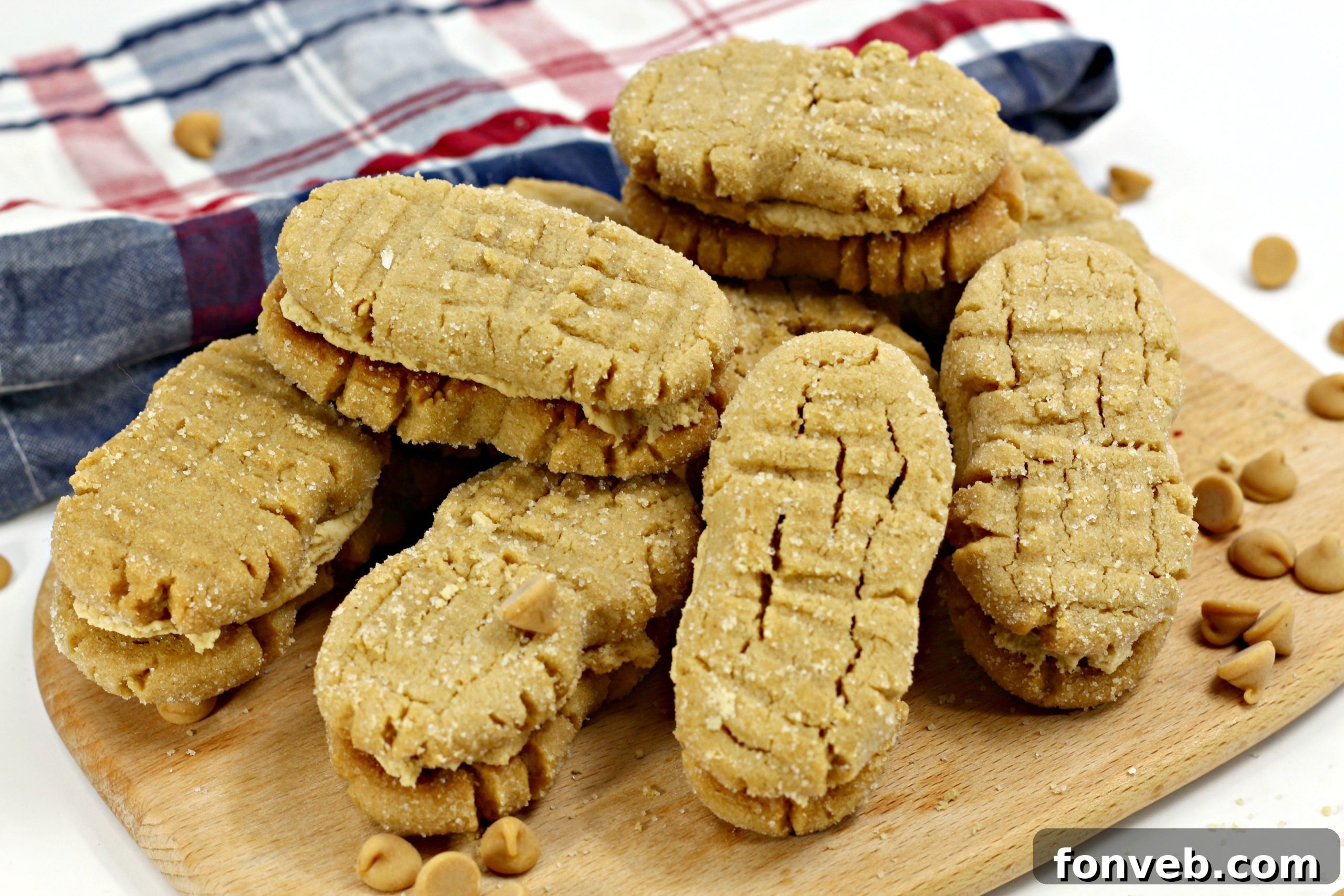 A close-up shot of a homemade Nutterbutter cookie cut in half, revealing the rich, creamy peanut butter filling inside.