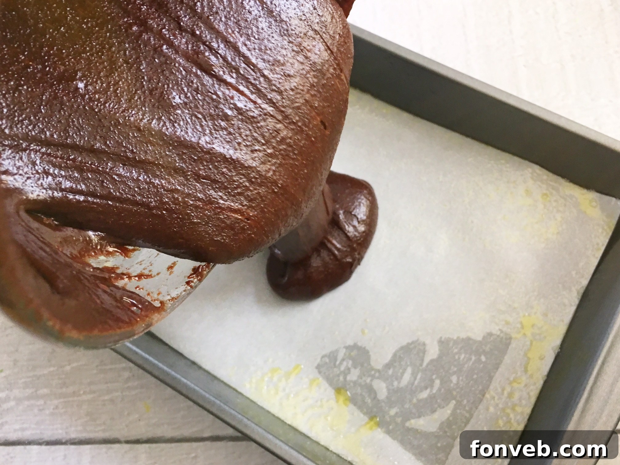 A tray of freshly baked Reese's Peanut Butter Cup Brownies with a knife, ready to be cut and served.