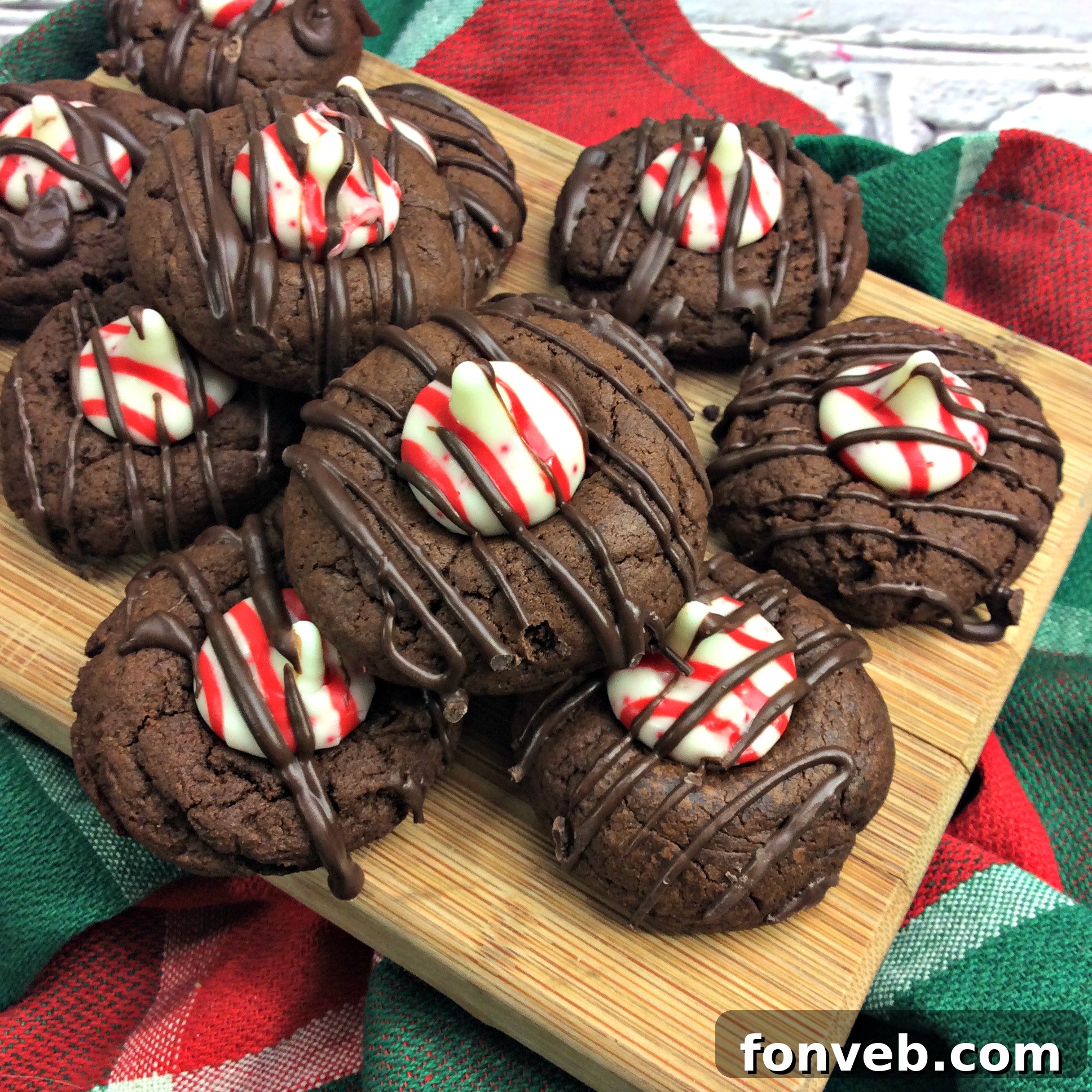 A stack of Chocolate Peppermint Thumbprint Cookies, ready for gifting or serving, emphasizing their perfect form and inviting appearance.