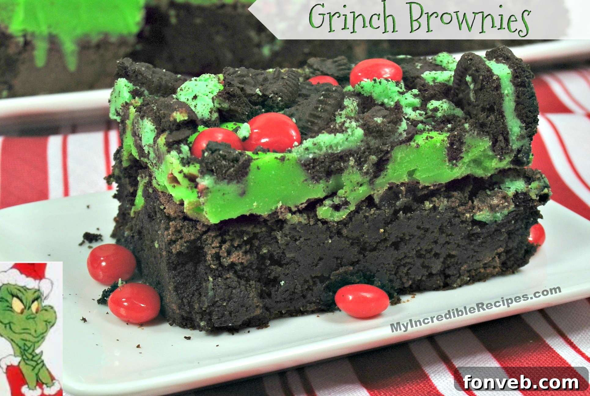 Grinch Brownies - fudgy chocolate mint Oreo brownies with green ganache and red hearts.