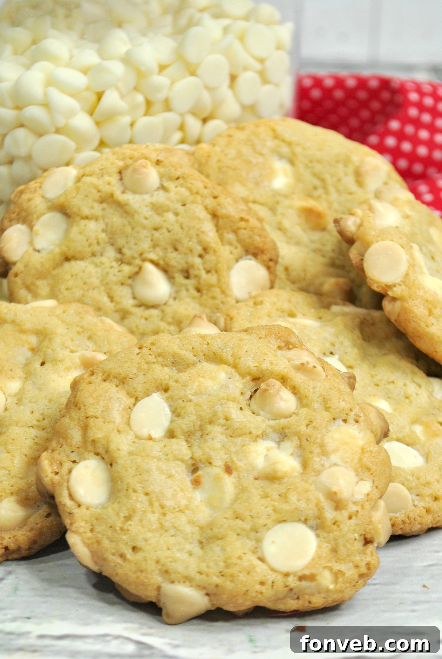 Close-up of a single Root Beer Float Cookie, featuring a slightly melted white chocolate chip and the cookie's soft texture.