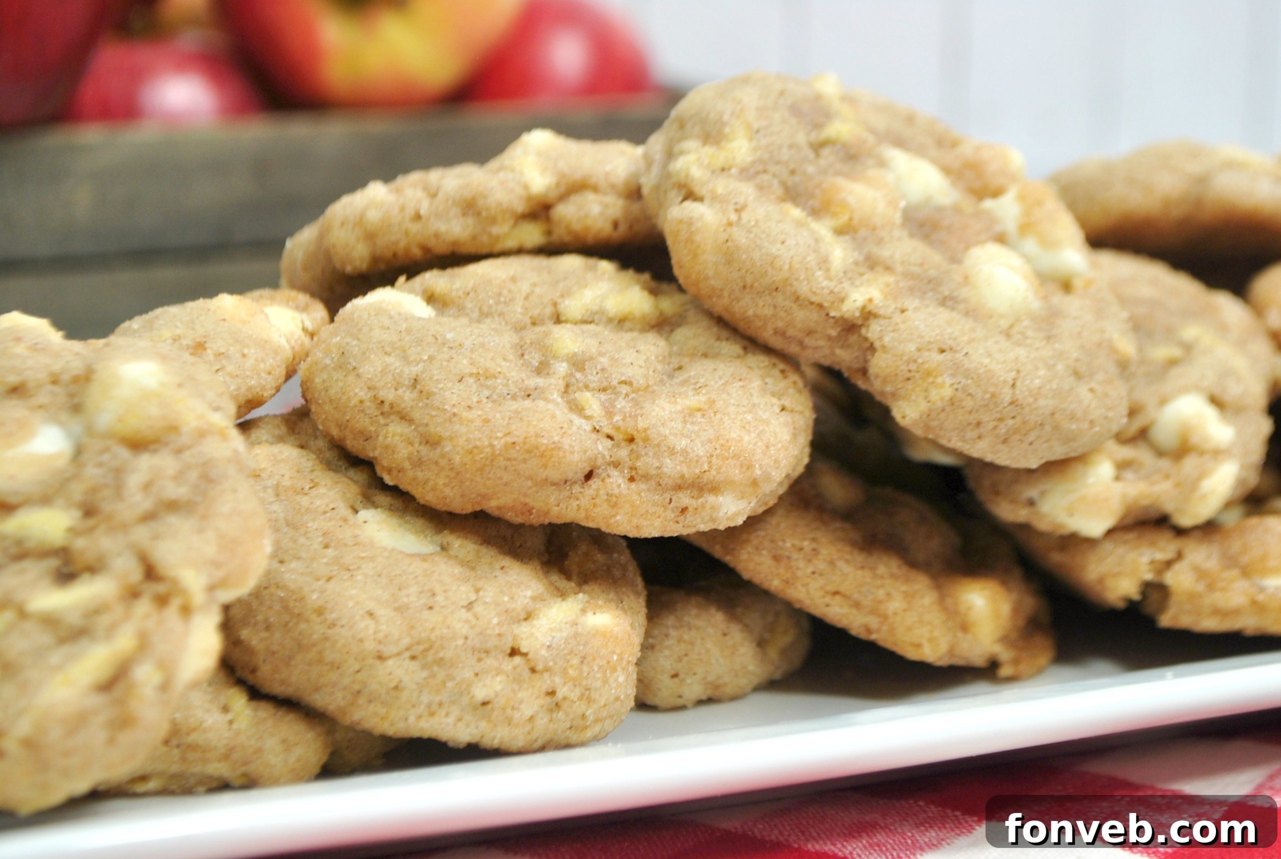 Several White Chocolate Snickerdoodle Cookies artfully arranged on a cooling rack.