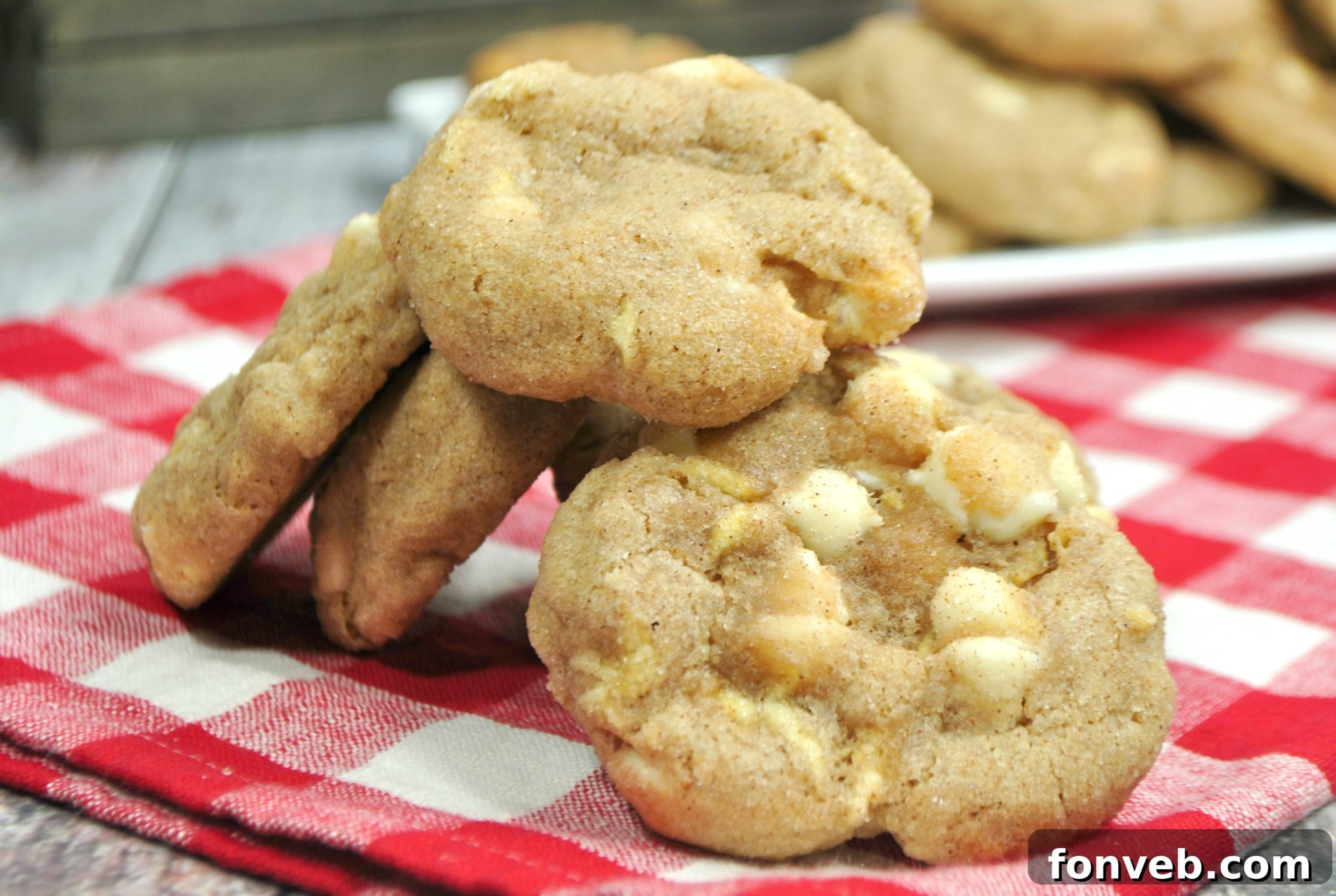 A plate of freshly baked White Chocolate Snickerdoodle Cookies ready to be enjoyed.