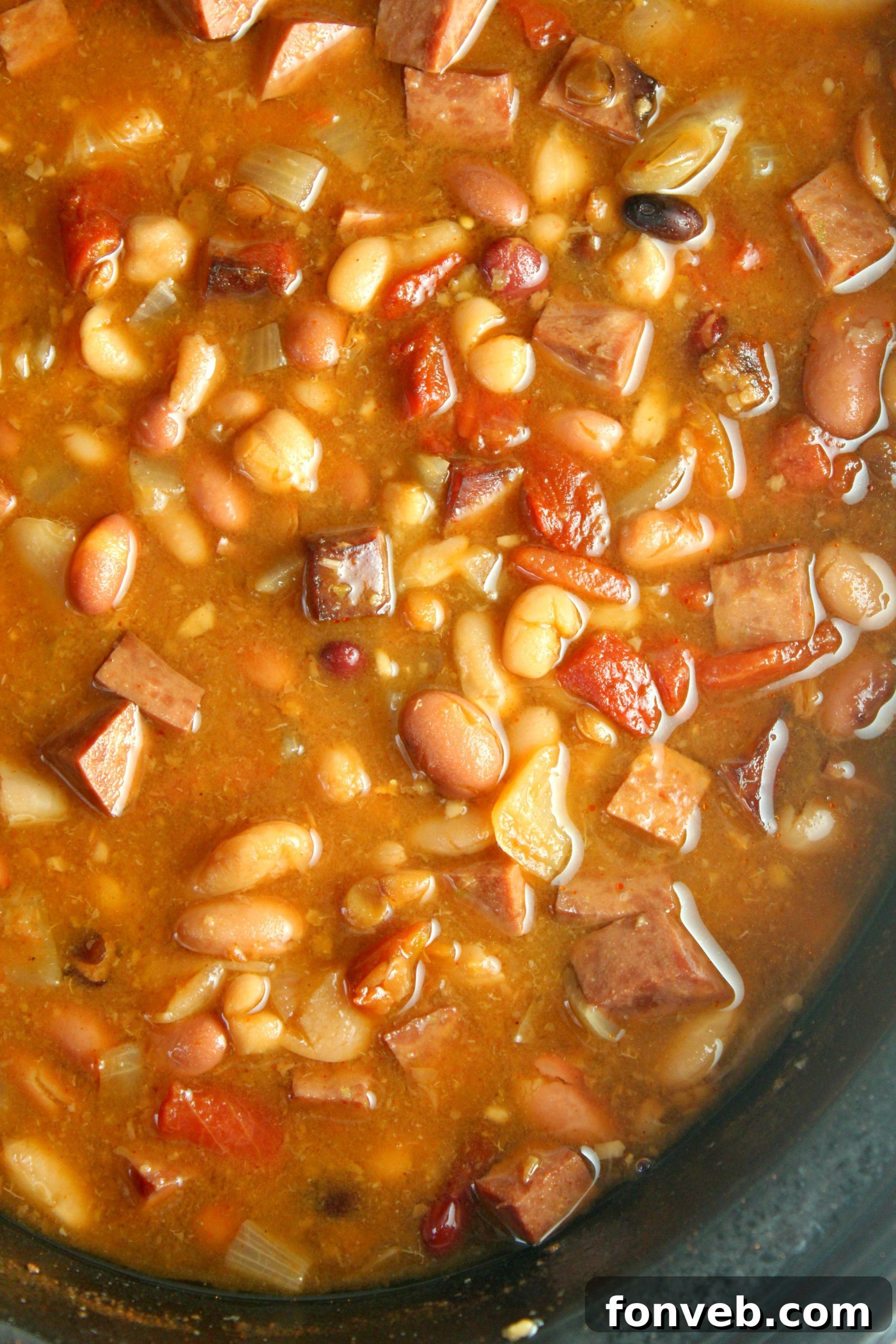 Set It and Forget It Ham and Bean Soup 5 Two bowls of Slow Cooker Ham and Bean Soup served with crusty bread