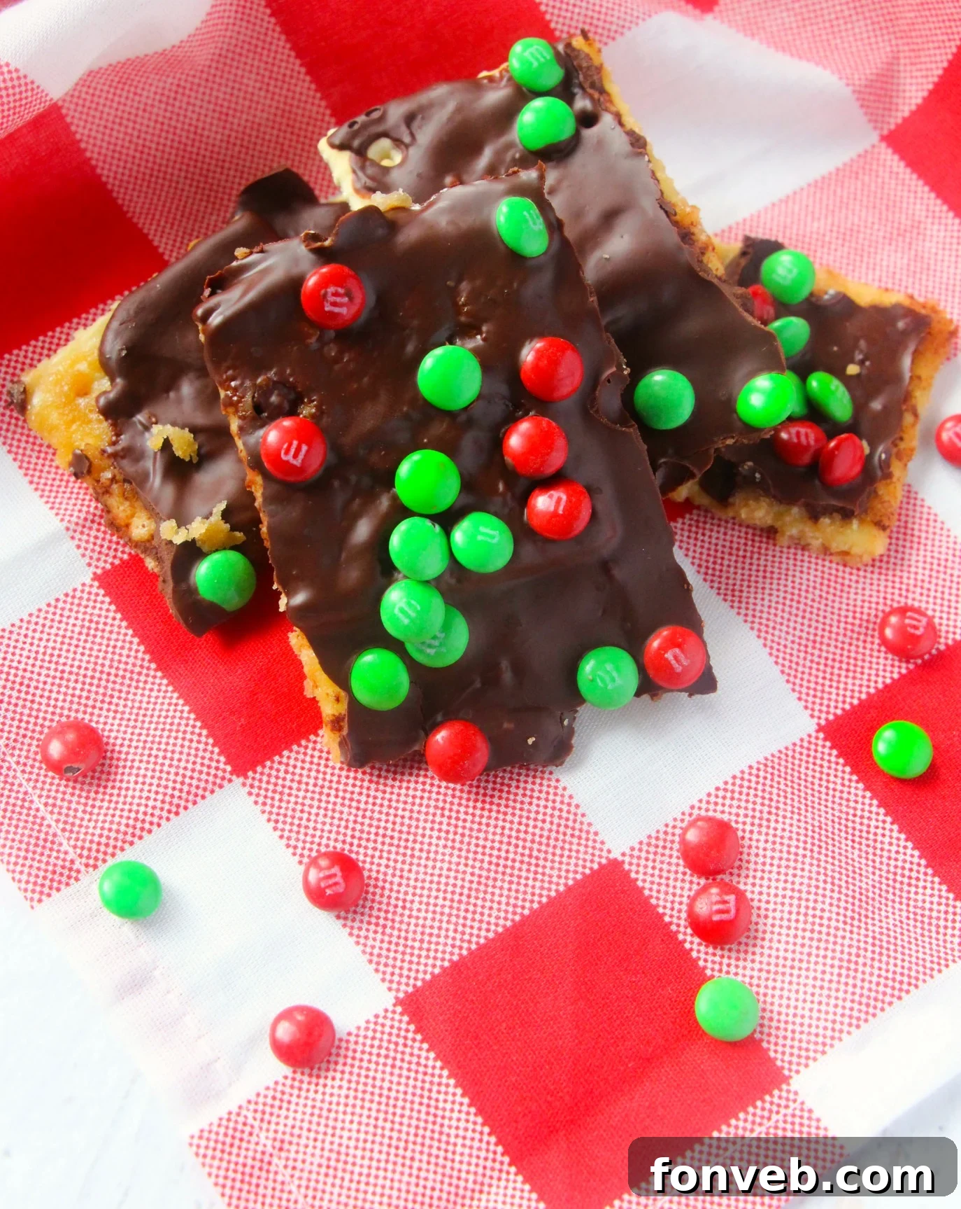 Another view of Christmas Crack, showcasing its glistening chocolate and colorful M&Ms, ready for a holiday celebration.